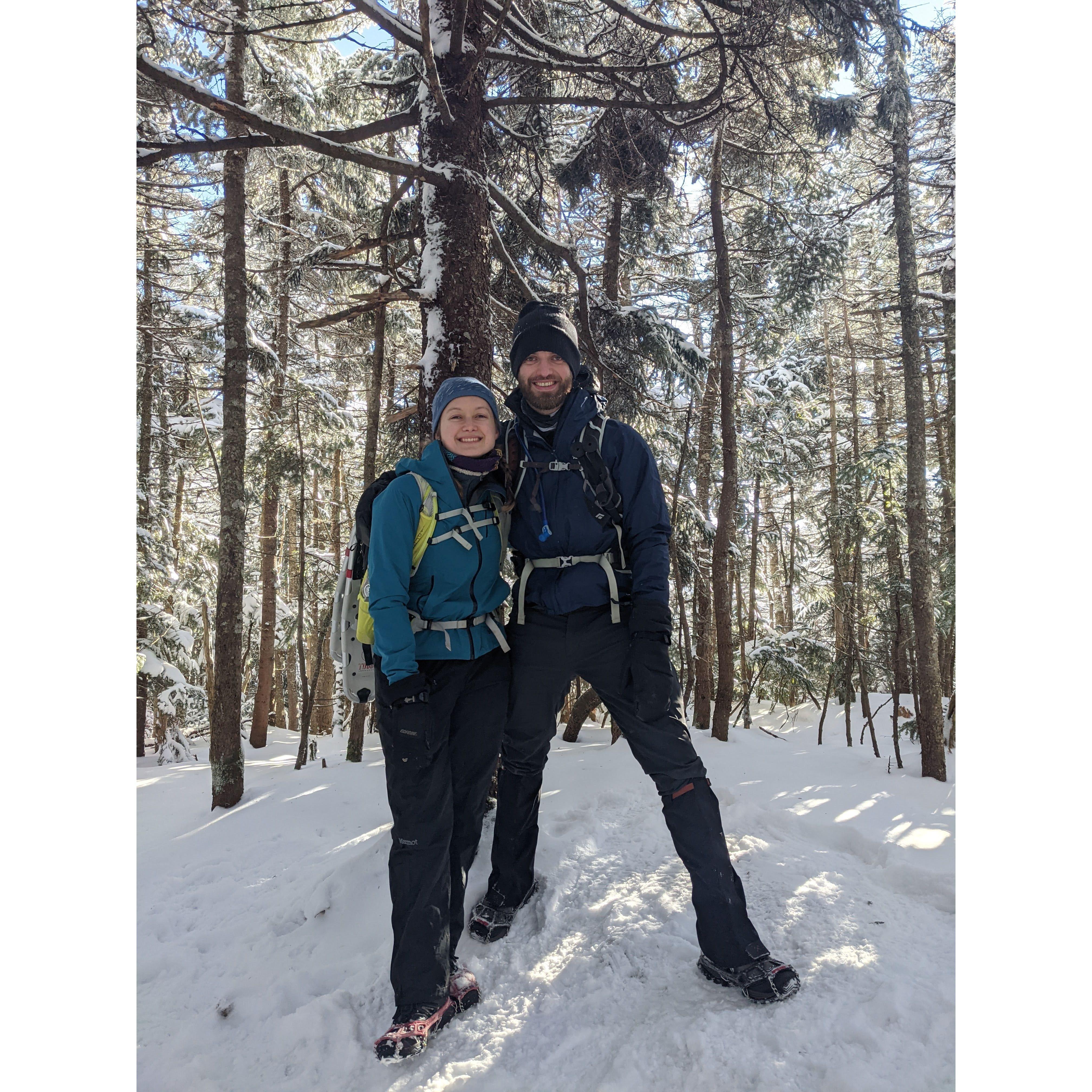 Hiking Mt. Passaconaway in NH, January 2021 - our smiles froze along with the rest of our faces shortly after this photo