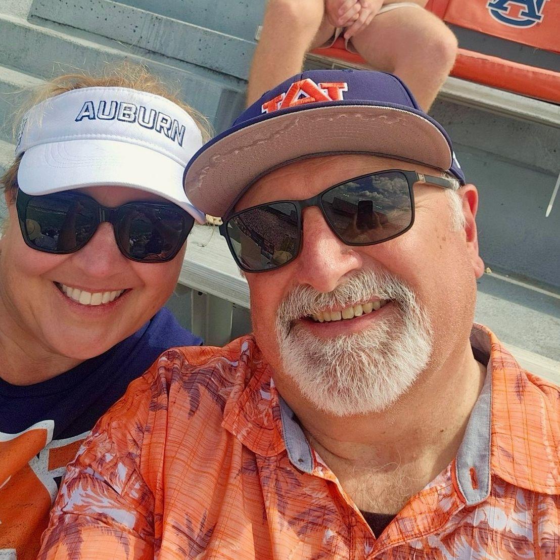 The bride and the groom at his favorite teams' football game!