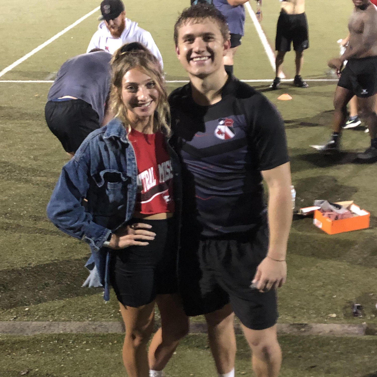 Aly supporting Aaron at one of his rugby games