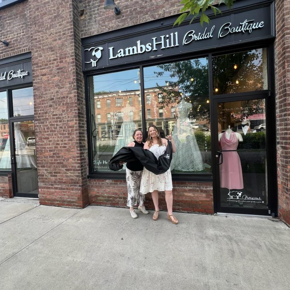 The bride and her mom picking up her dress !