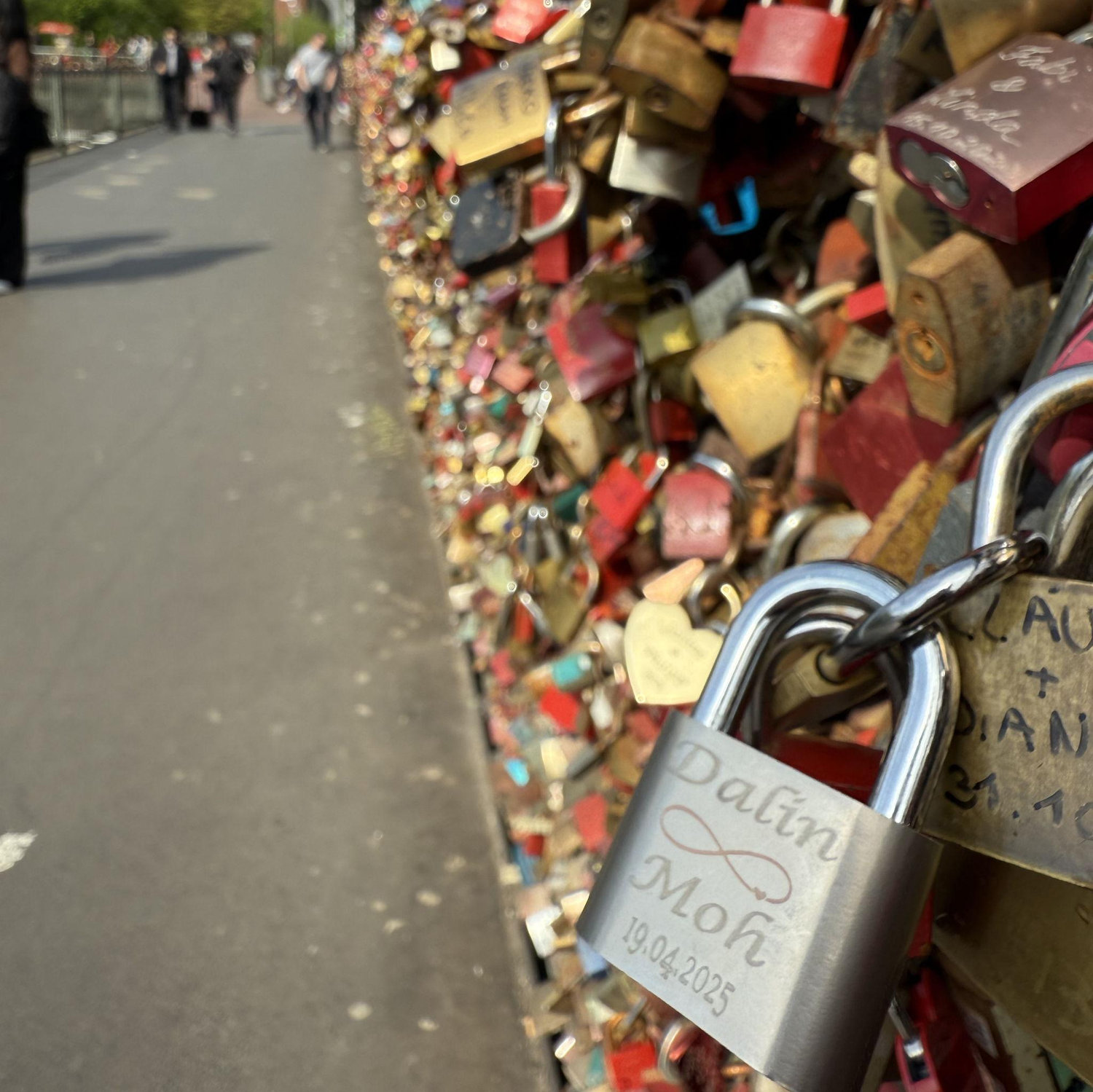 One of our favorite traditions is placing locks with our initials - this one is in Cologne, and we have another one near the Sacre Cœur in Paris back in 2024