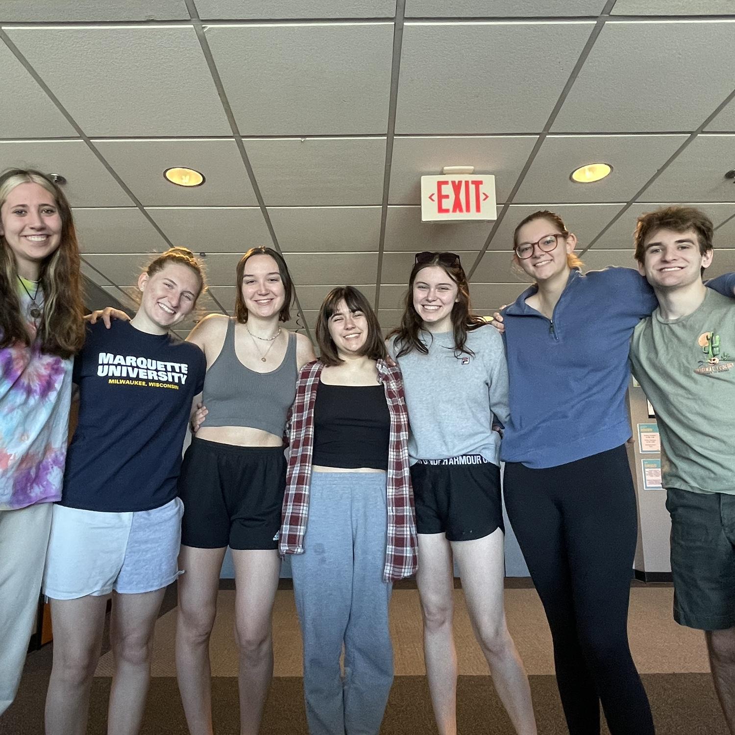 The brides with wedding party members Maggie, Maya, Olivia, Cora, and Hunter on their last day of Freshman year at Marquette 2022!