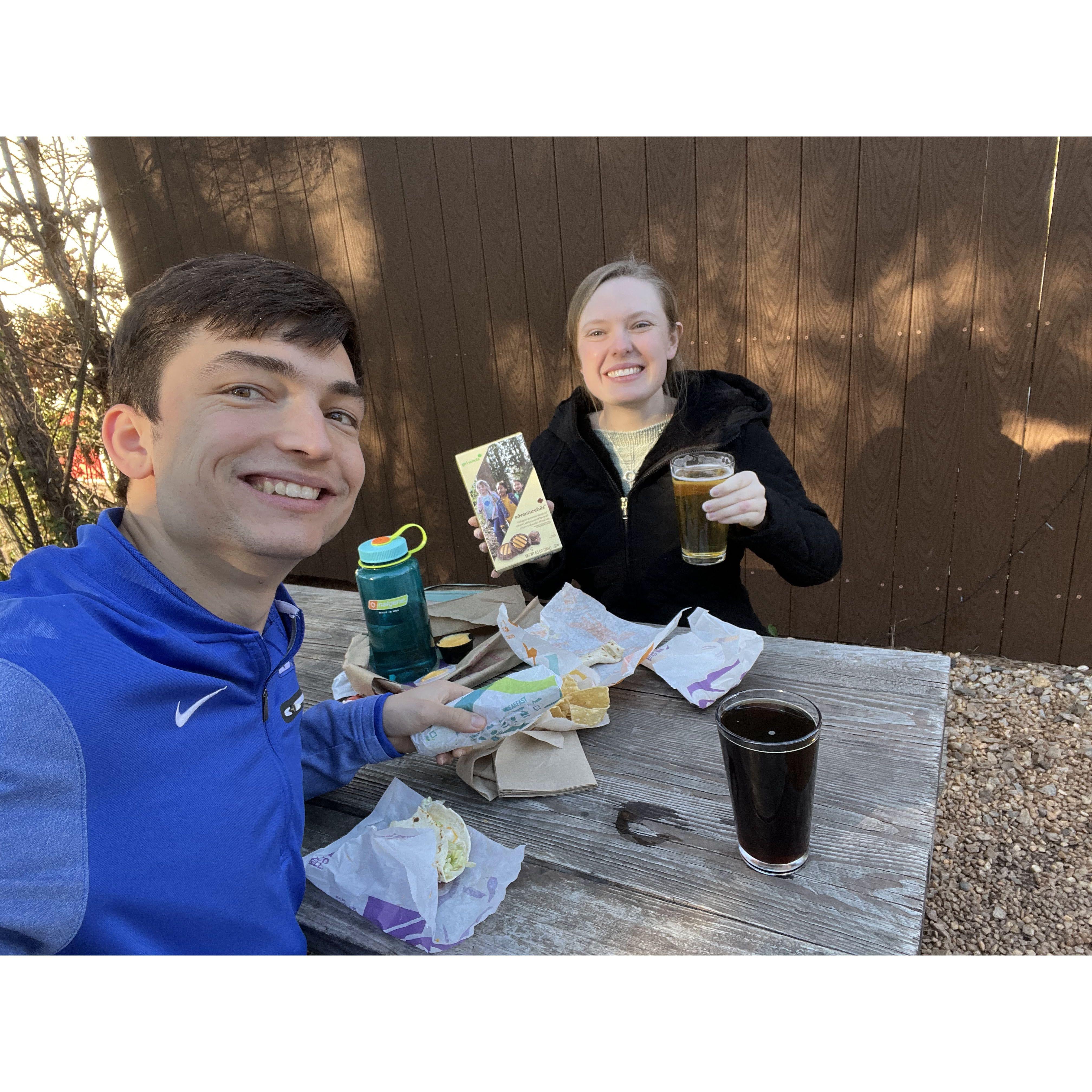 Capping off a day of trying on engagement rings with Taco Bell, Girl Scout cookies, and beer. Zoom in to see Georgie's swollen ring finger from the day's work