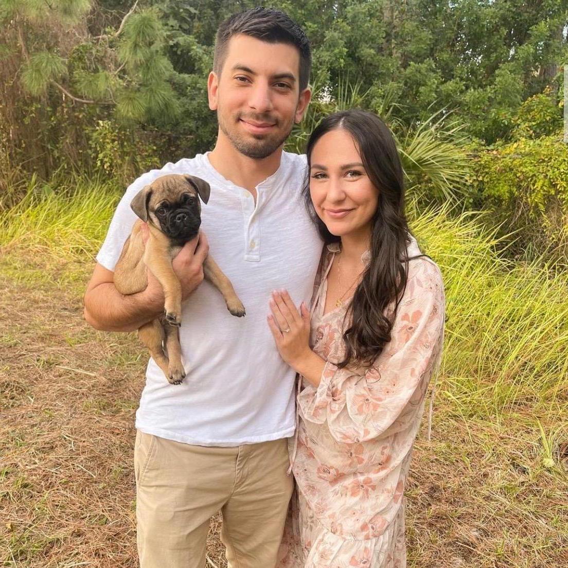 Our first family picture with our new puppy, Otis!