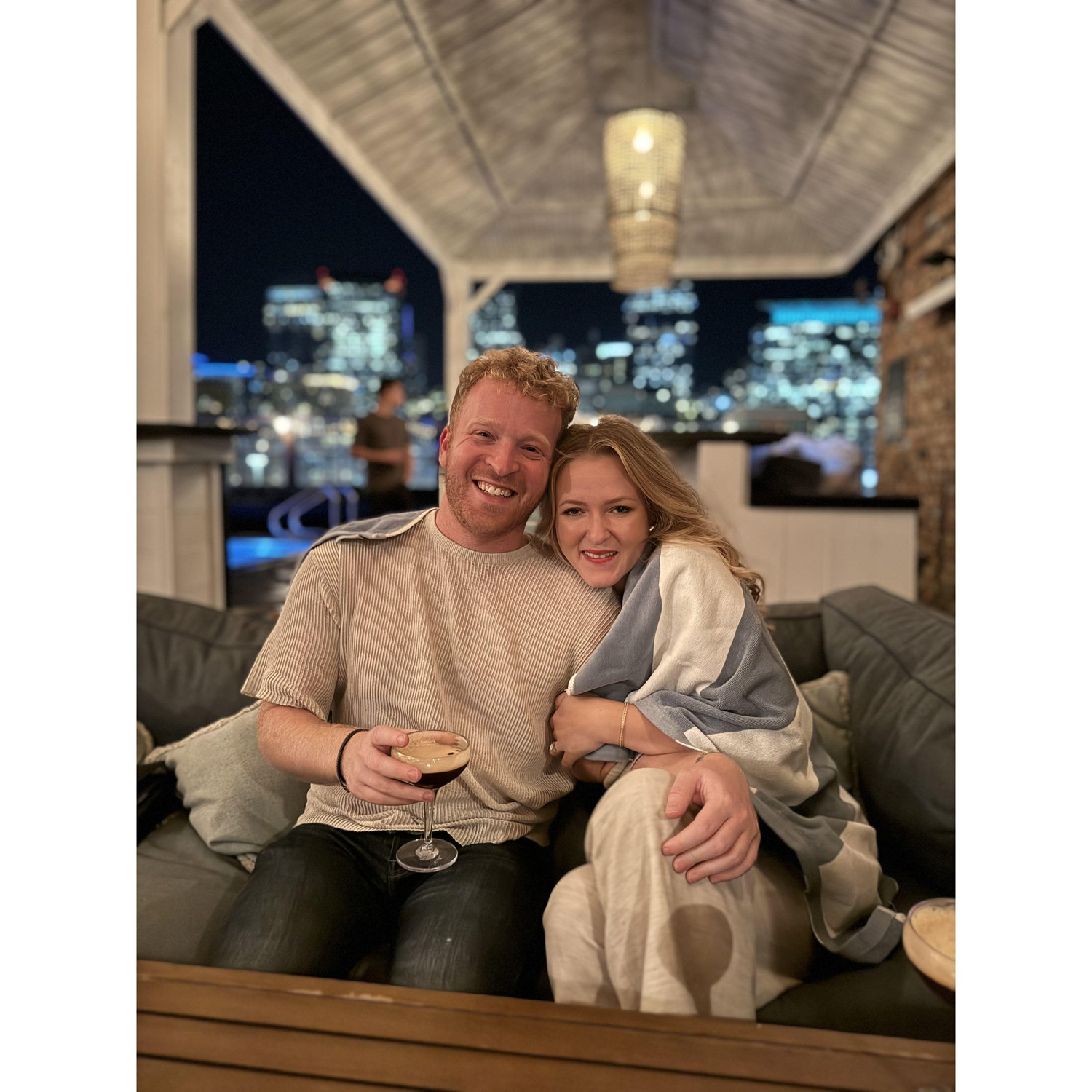 Cuddling at the SoHo House rooftop while enjoying an espresso martini