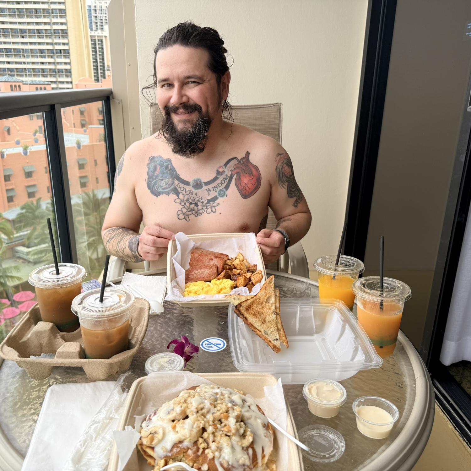 Local eggs, spam, and potatoes; banana pancakes topped with bananas, macadamia nuts, and coconut syrup; pineapple and POG juices; and Maui iced coffee in Waikiki | 04/18/26