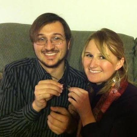The couple showing off matching talismans gifted to them one holiday.