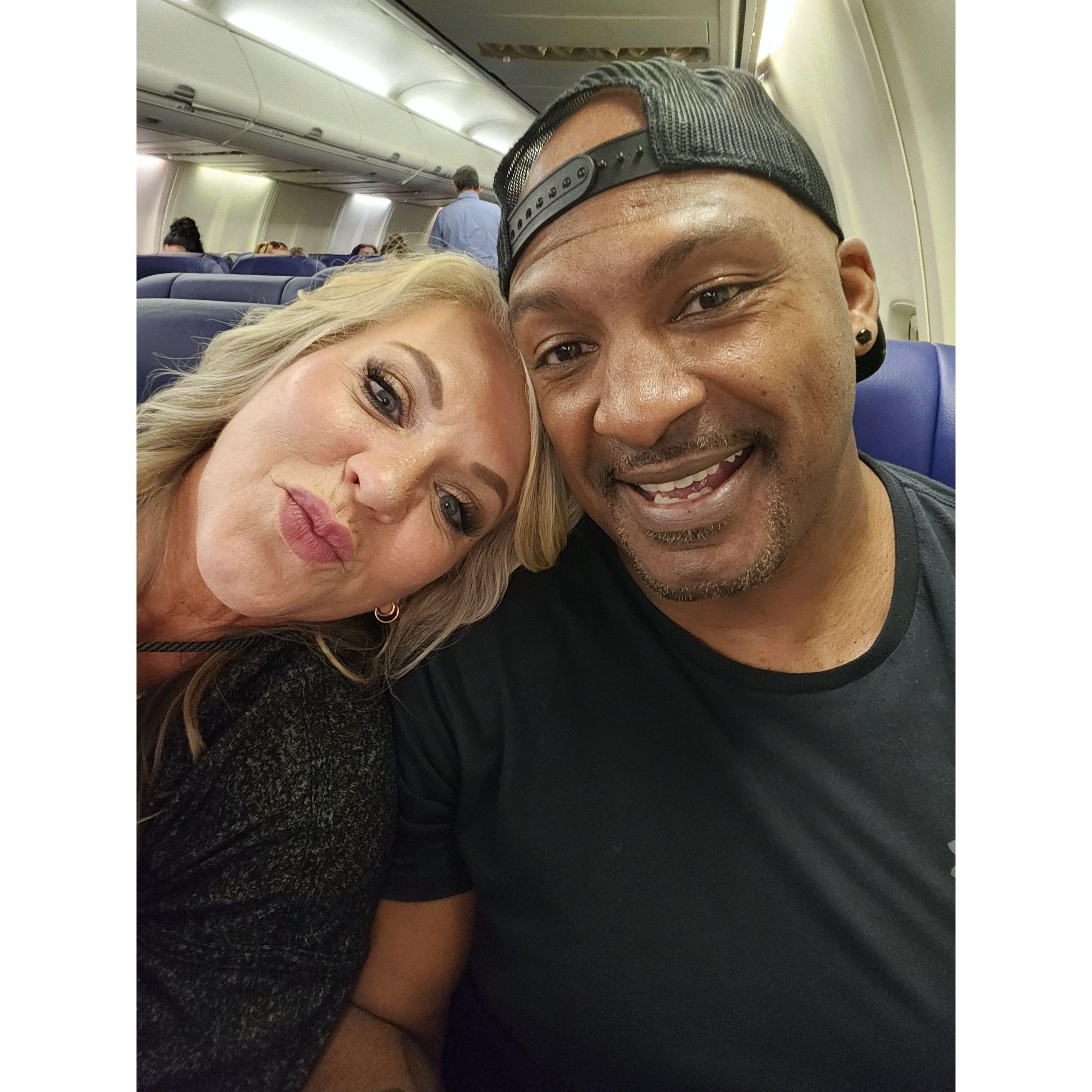on the plane, ready to begin our honeymoon