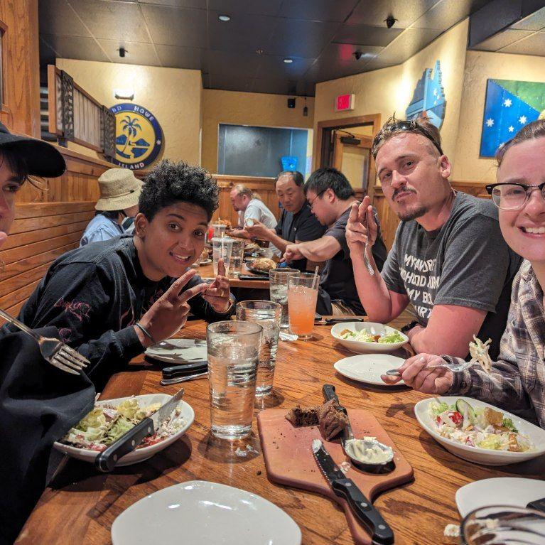 At Outback Steakhouse with friends after a river tubing trip!