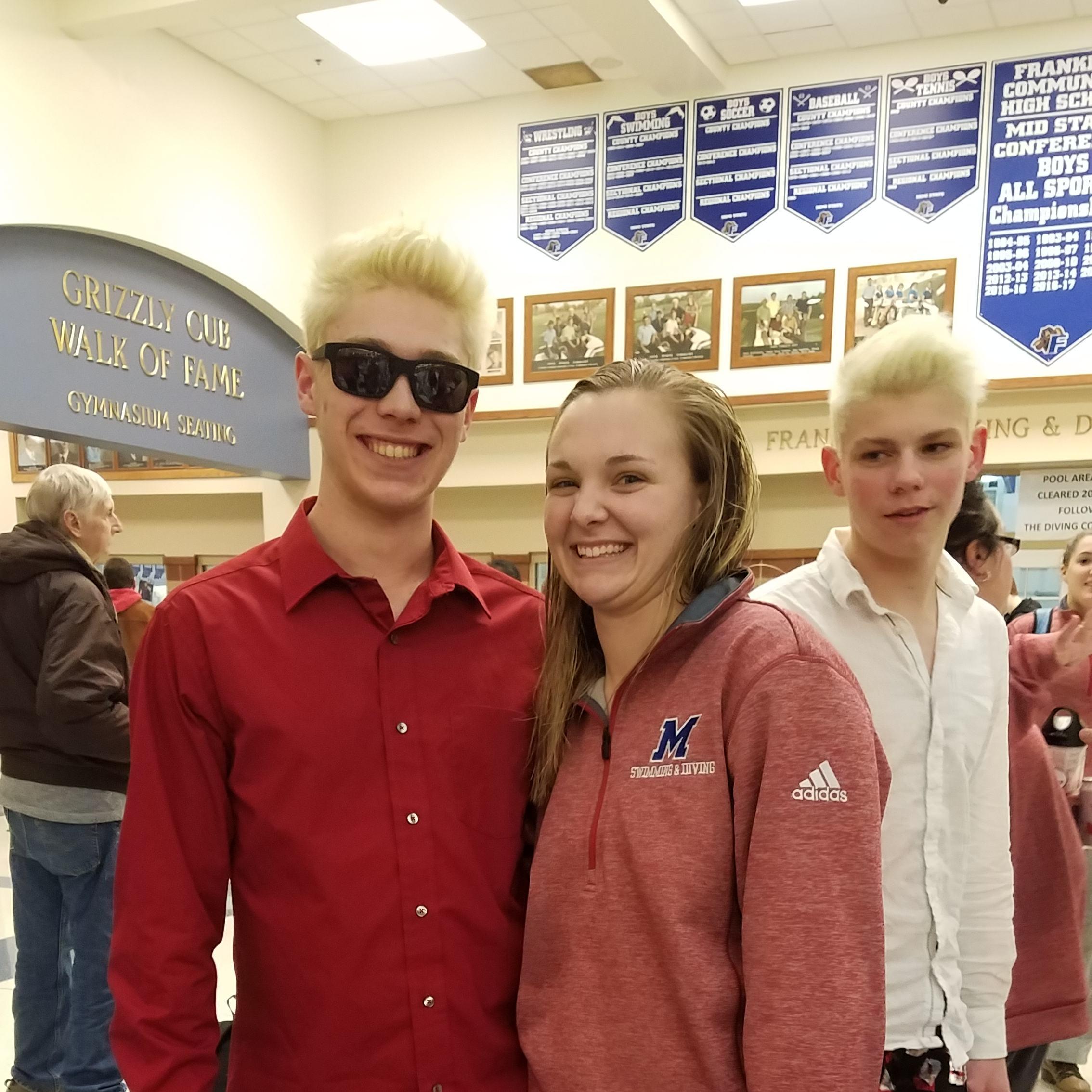 Miles in Risky Business attire supporting Ally in the girls swimming sectionals