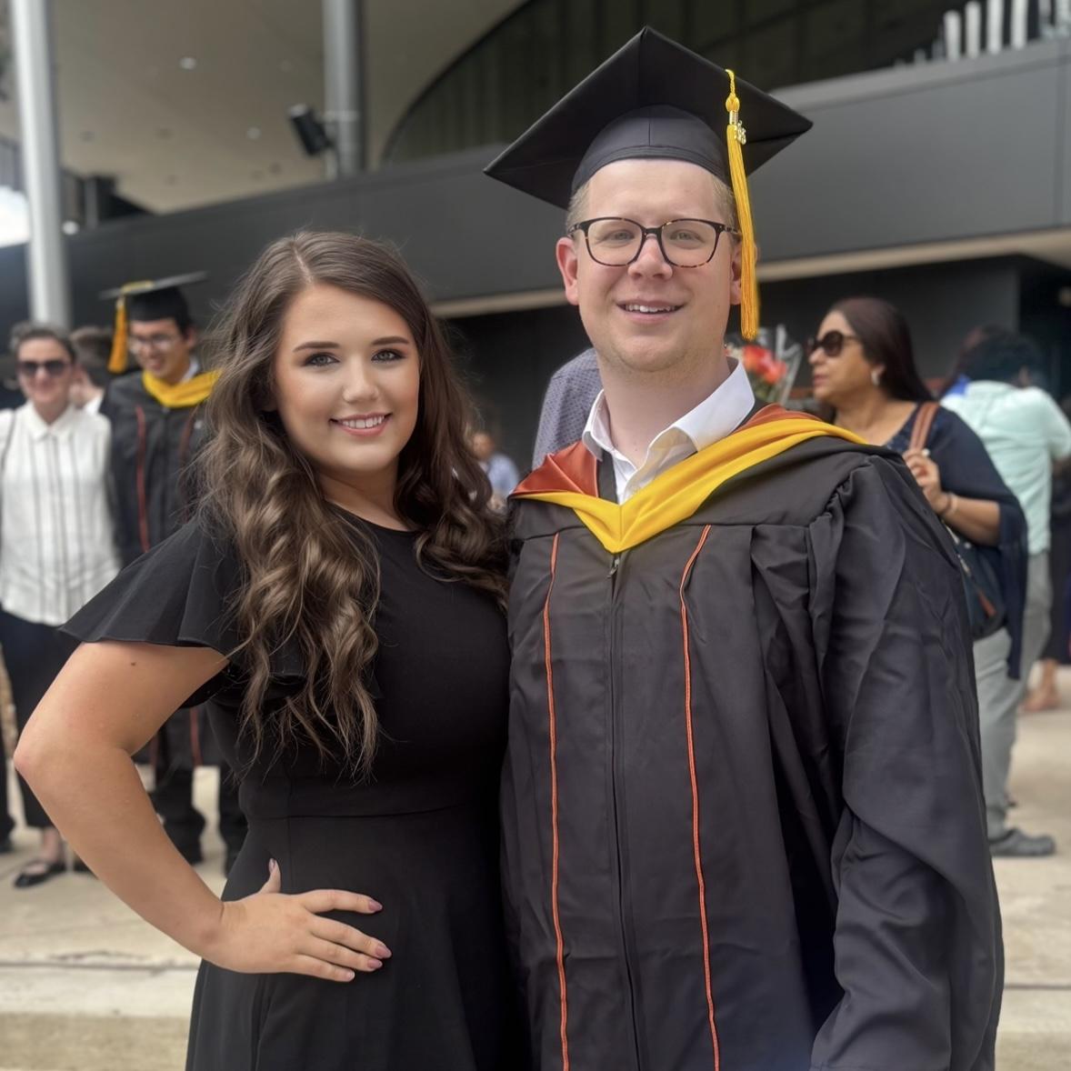 Us at Derek’s UT commencement ceremony for his M.A. in Data Science— May 2025