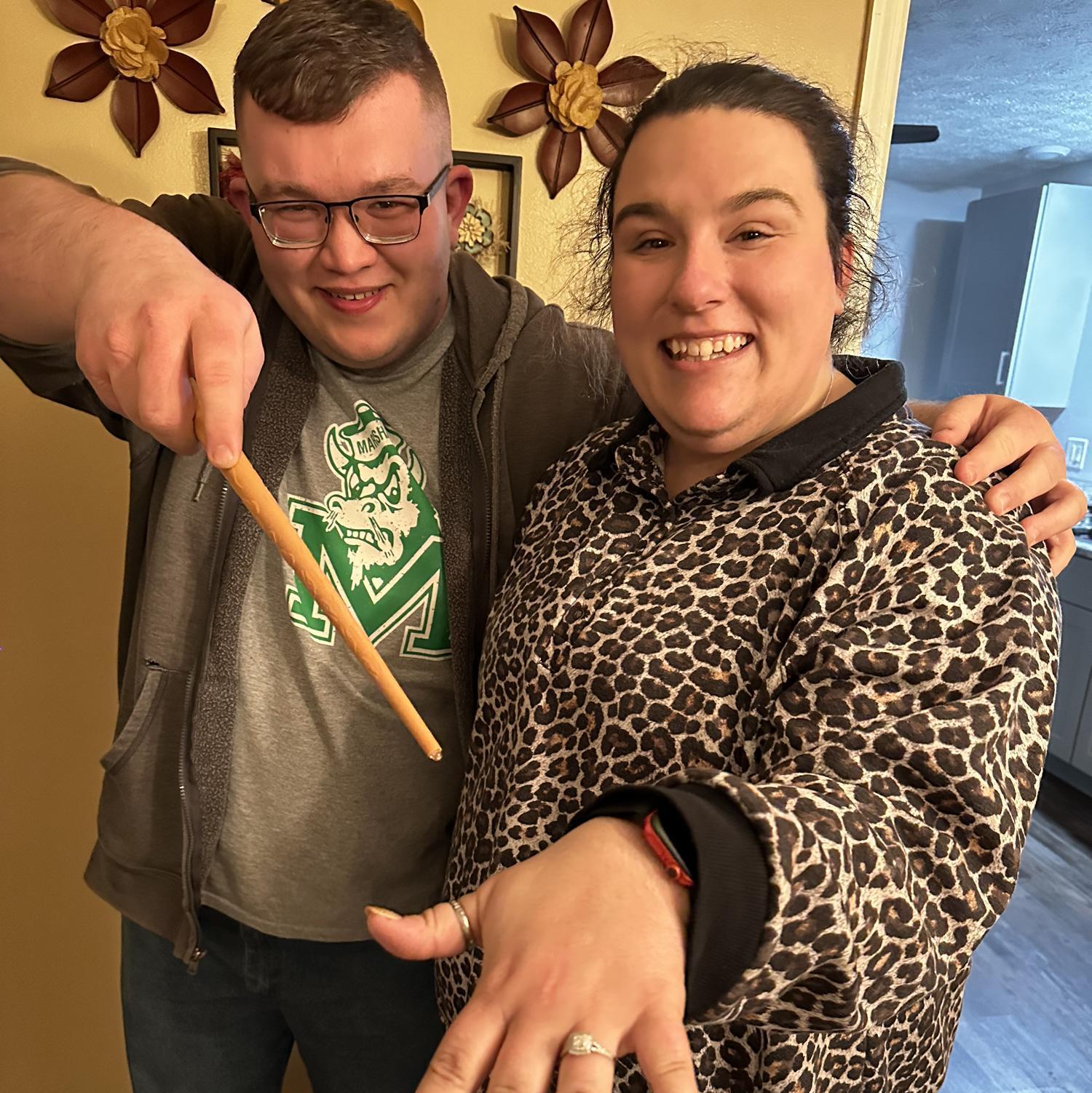 Drew proposed with one of Emma's favorite things- Harry Potter! He had a bonfire for his birthday and placed the floating candles from Harry Potter around the fire. It was purely magic!