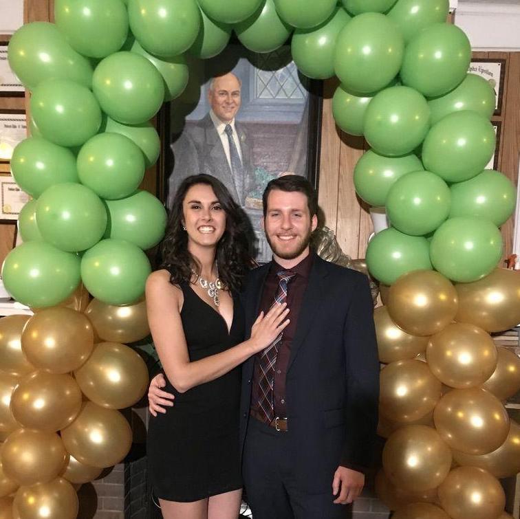 Louis' fraternity formal under the balloon arch he created!