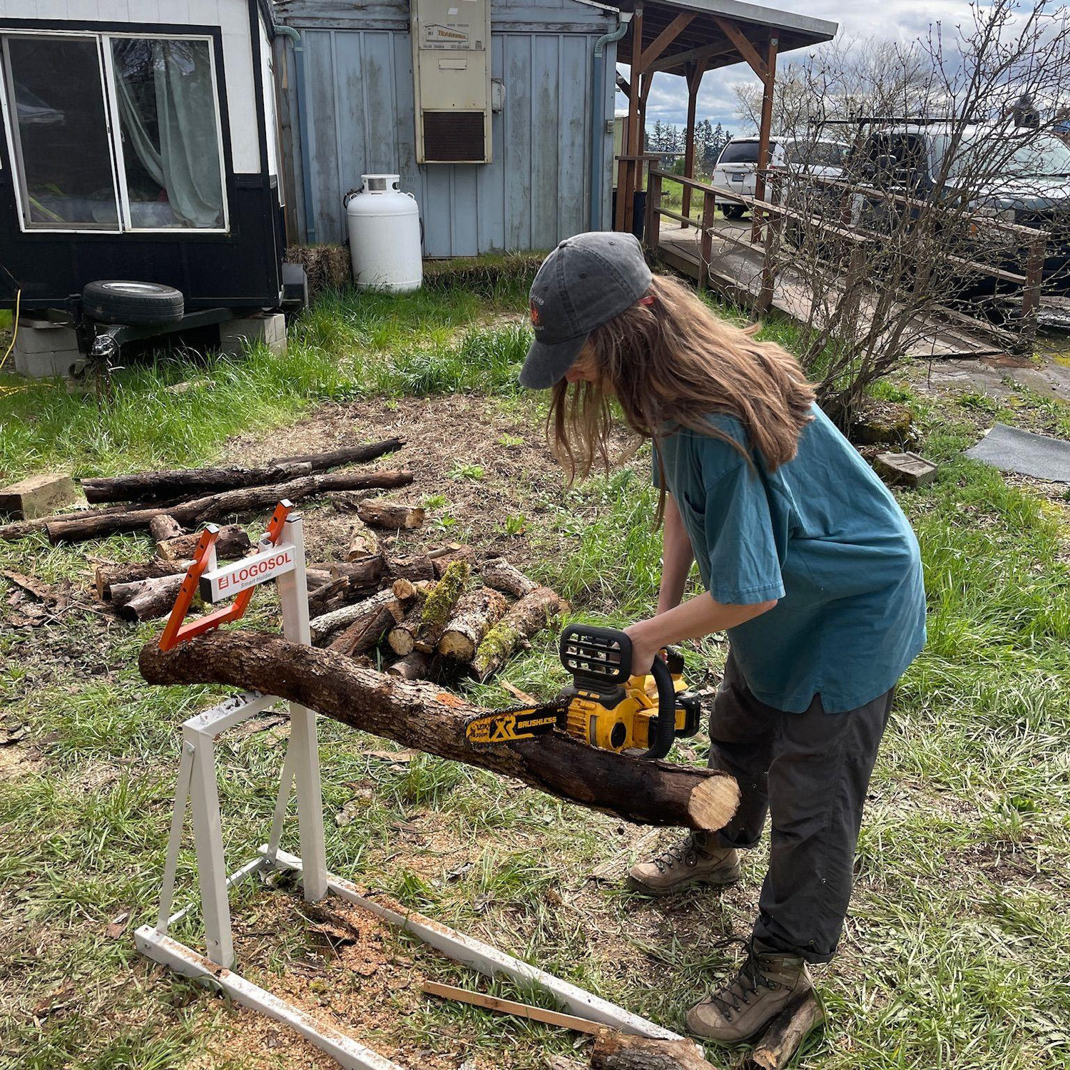 Maia learning how to run a chainsaw on the same trip.