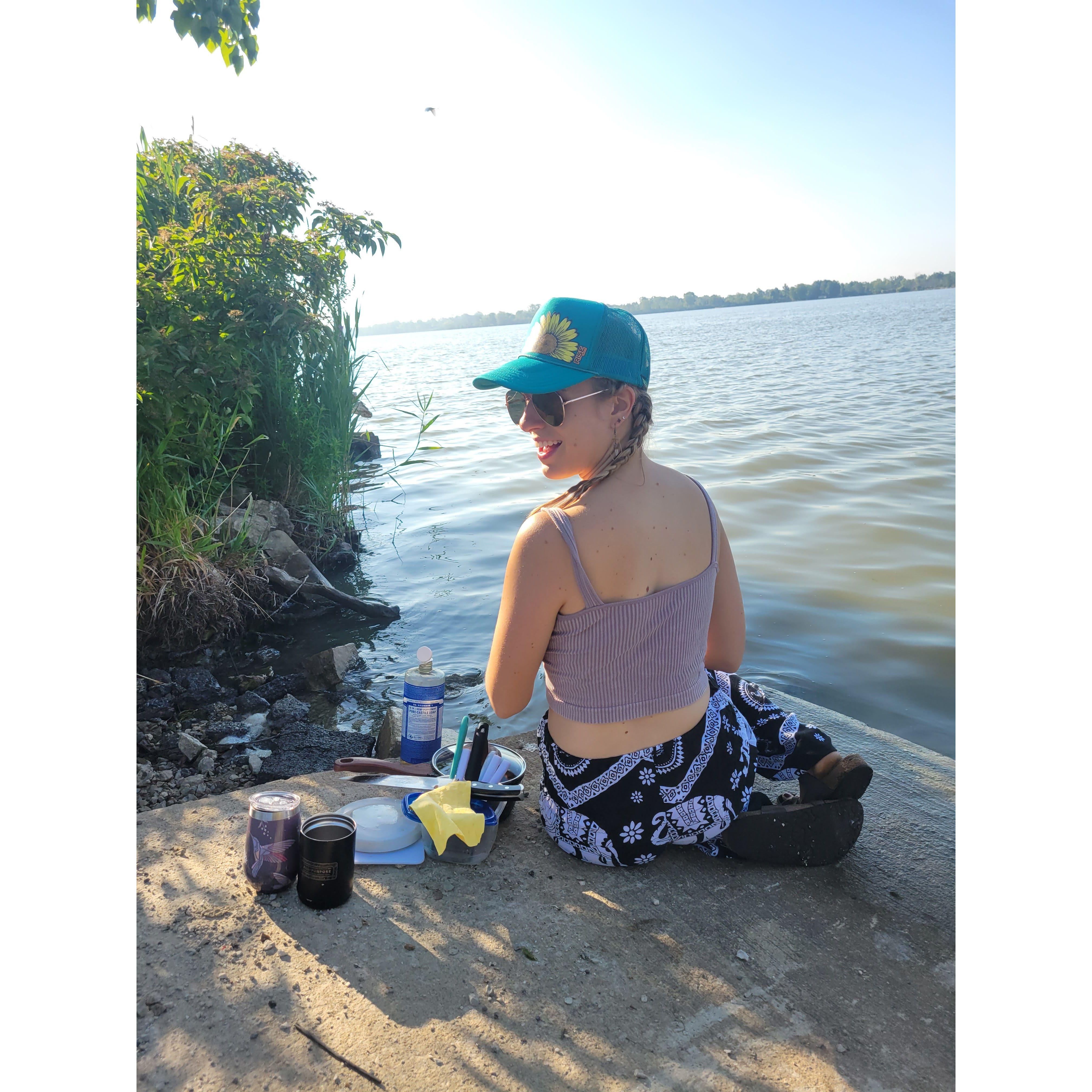 Camping dishes in the river