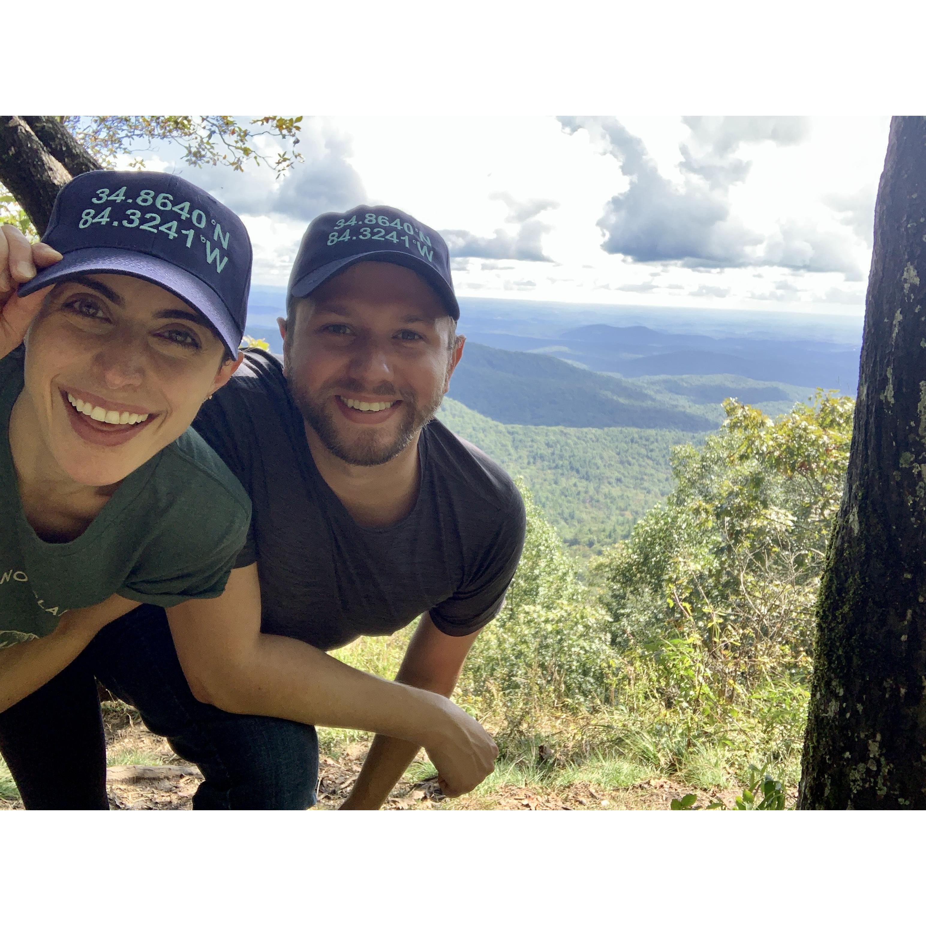 We took a one year engagement anniversary trip (a couple months early!) to re-visit the spot where we got engaged. Our hats have the coordinates of the summit of our hike where Chris proposed.