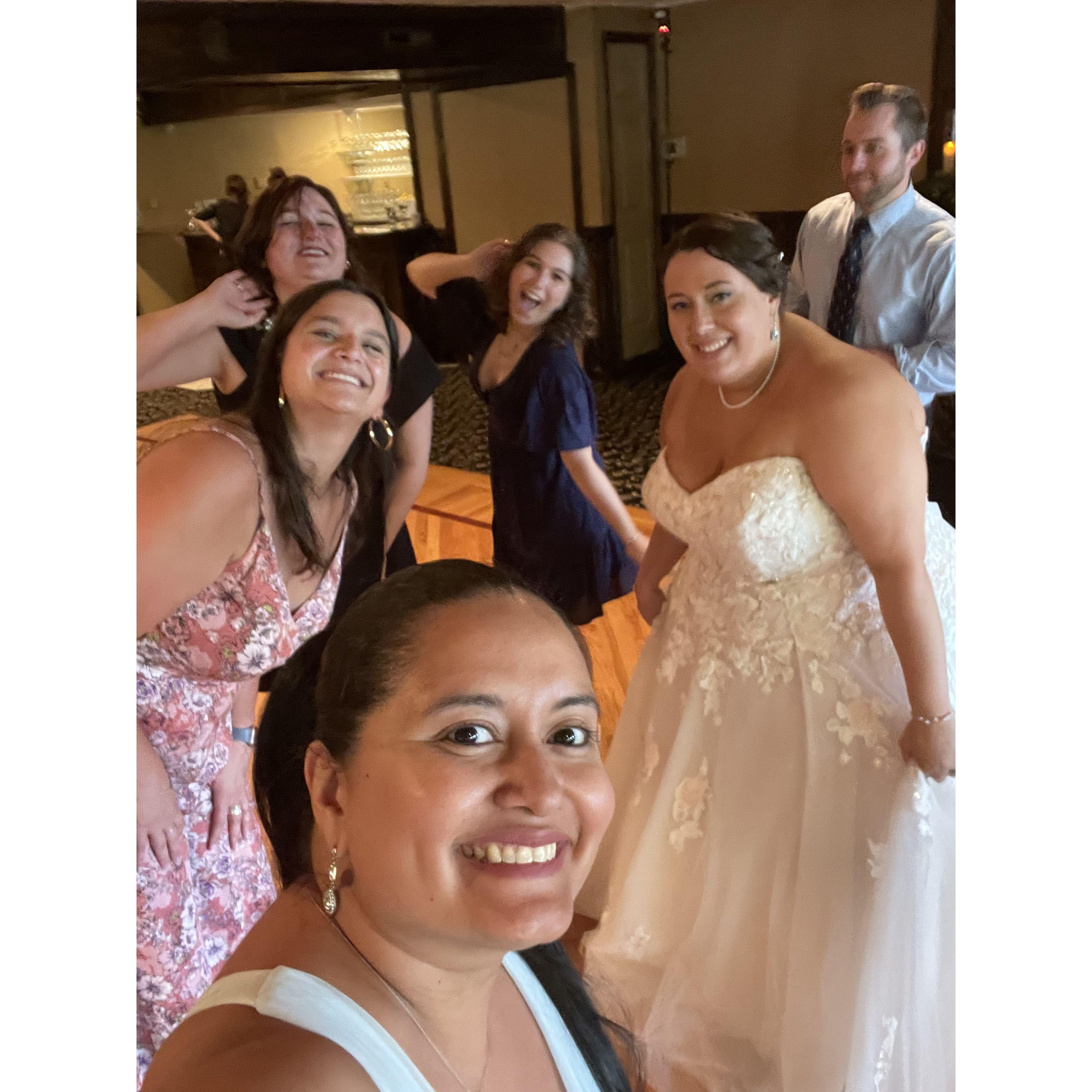 Victoria, Kristen, Marina, Carlye, Holly, and a blurry Derek at Holly's wedding 2022