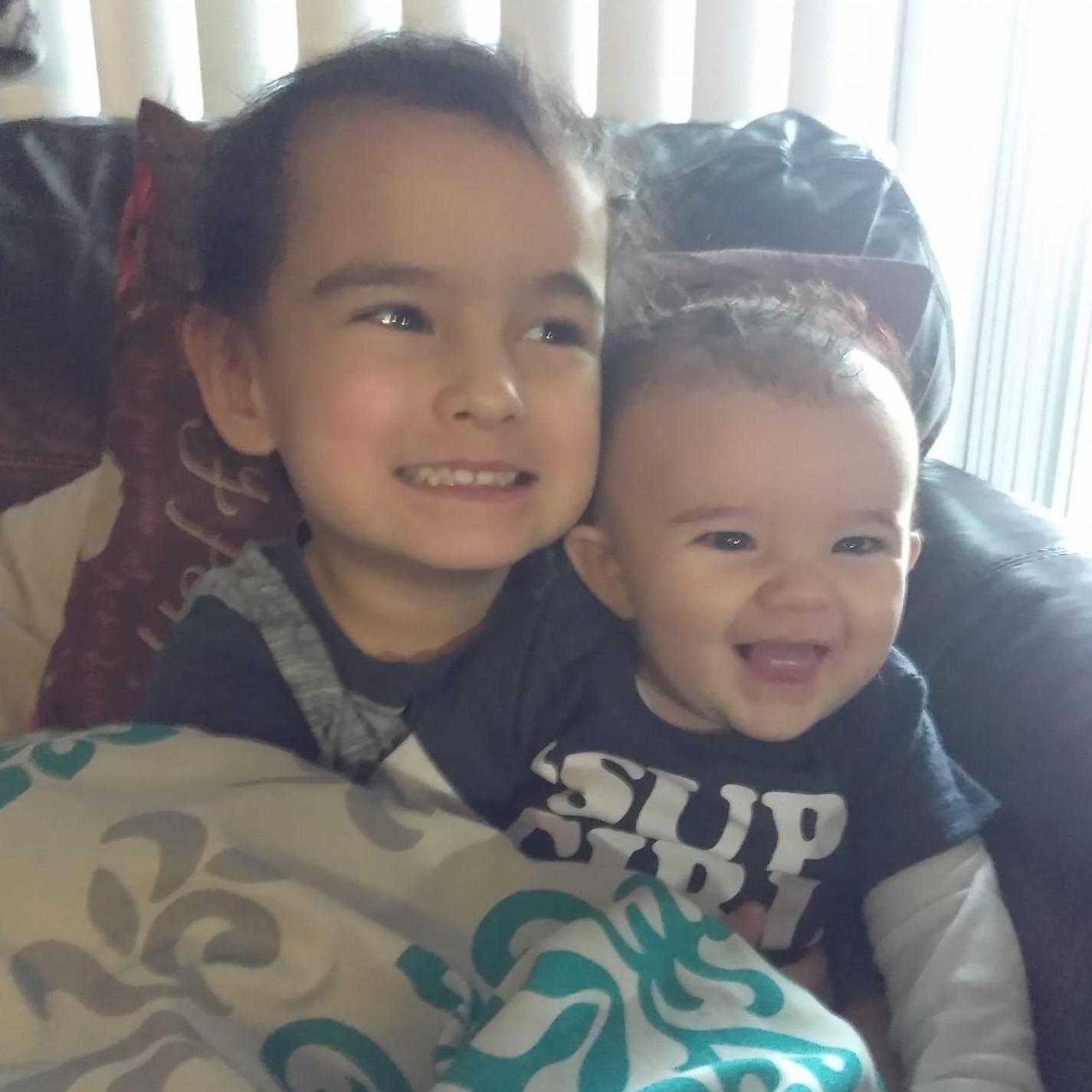 Mr. O giving Little Lyra some big brother cuddles.
