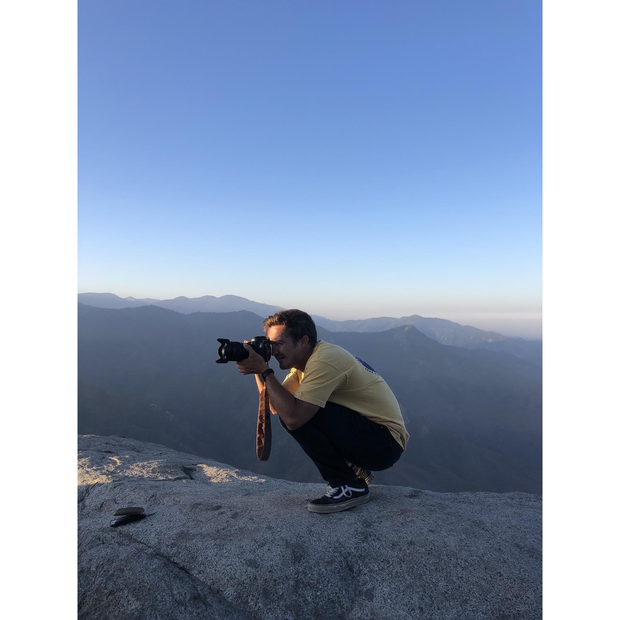 taking pictures of the sunrise over moro rock in sequoia