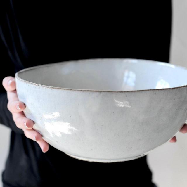 White, light gray ceramic bowl .