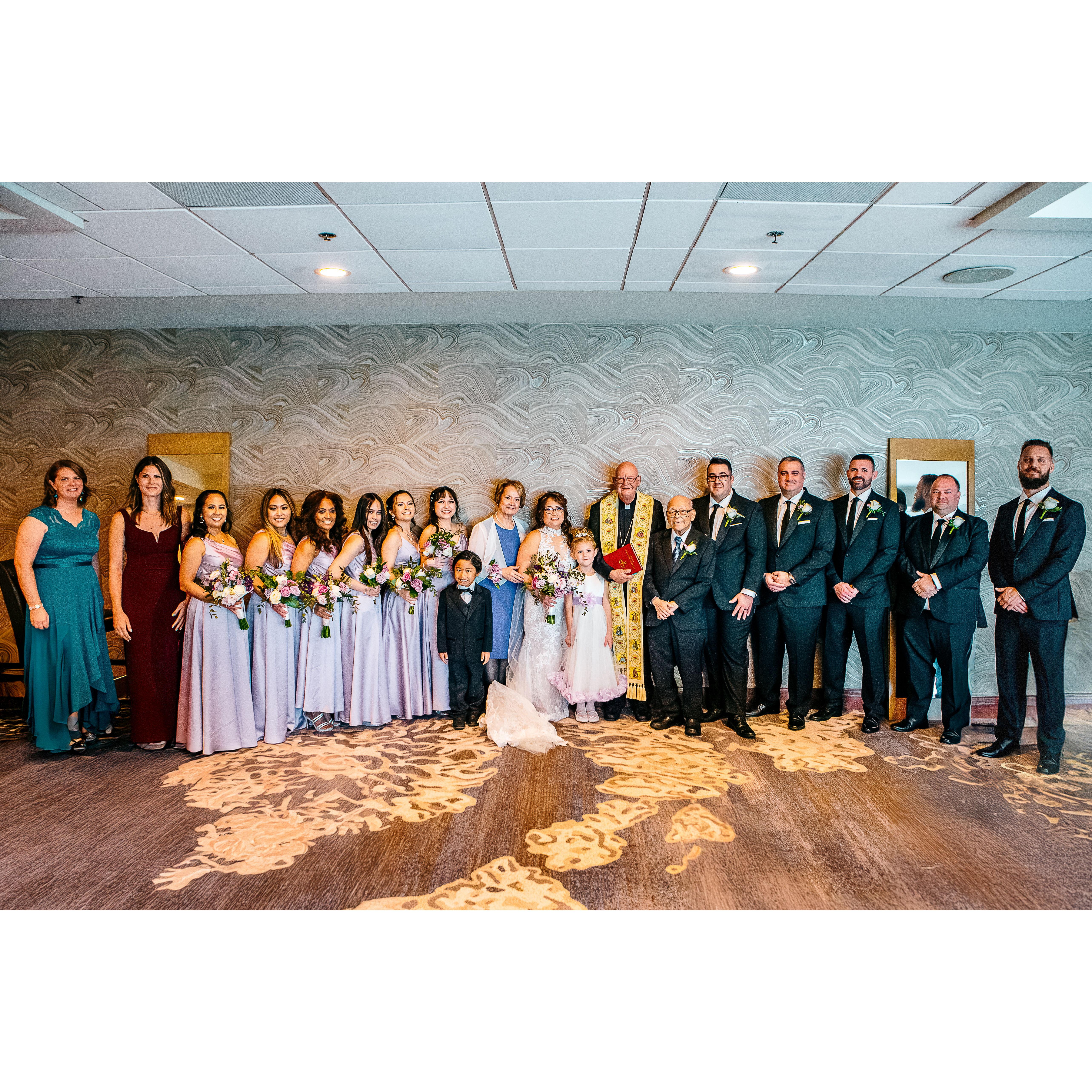 Wedding party with family and Officiant