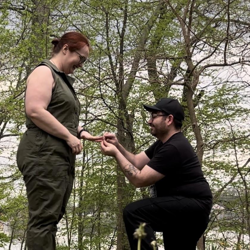 She said yes under the shade of the oak trees at the cottage.