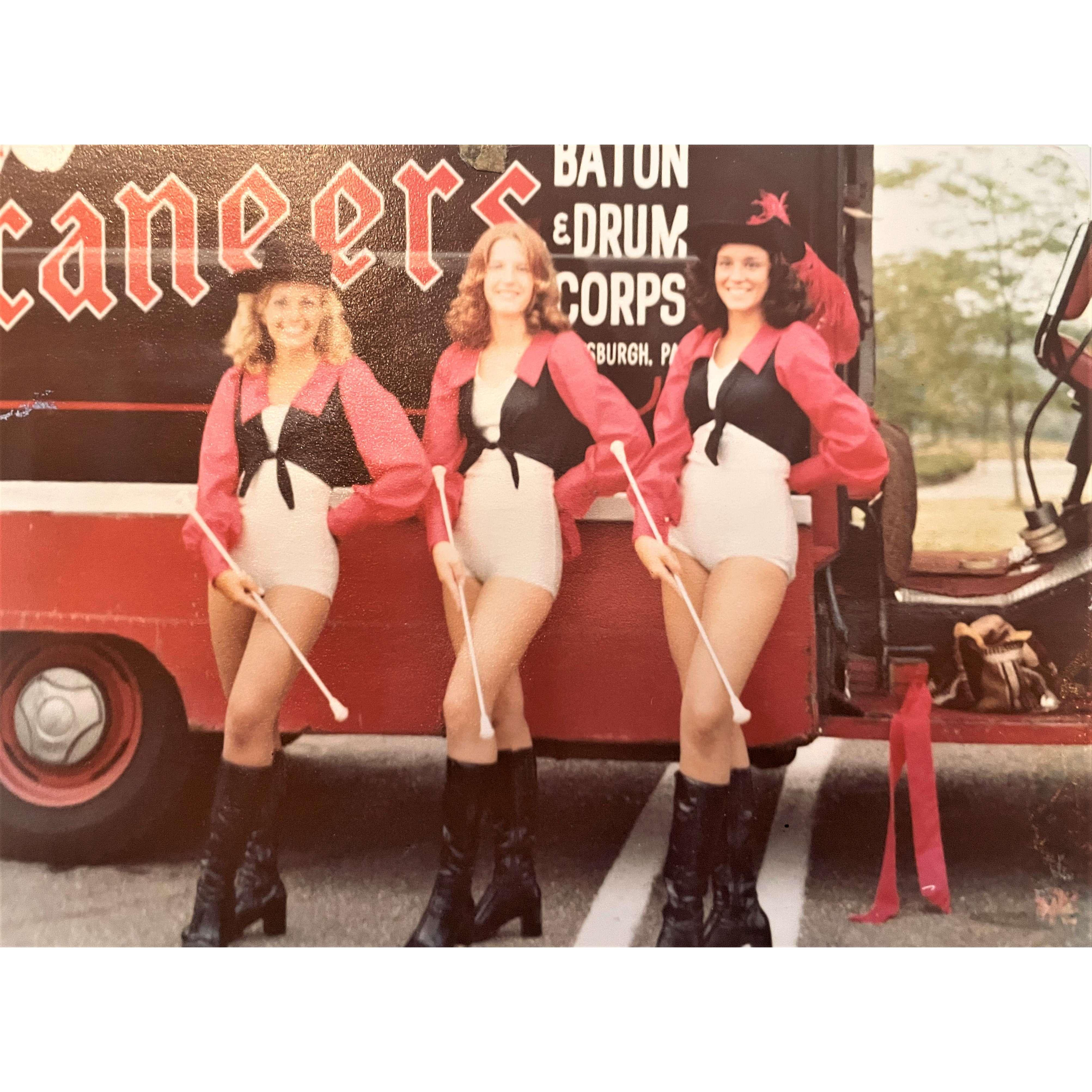 Marcia & Wendy (bridesmaid) right to left, strike a "pose" before a parade (maybe 1974)