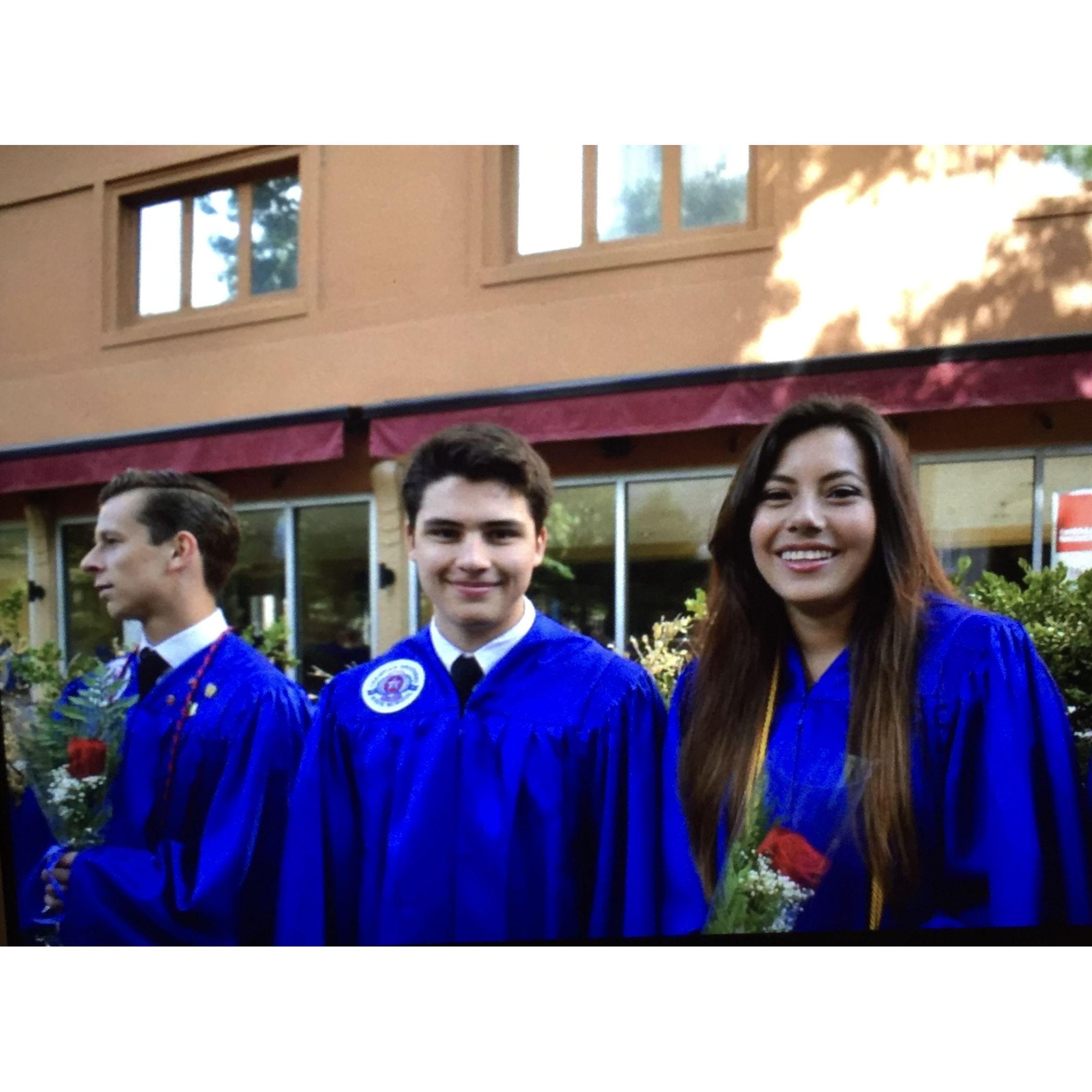 Little did we know this would be our first photo together. We barely knew each other, but by pure coincidence were placed together in line at our high school graduation.