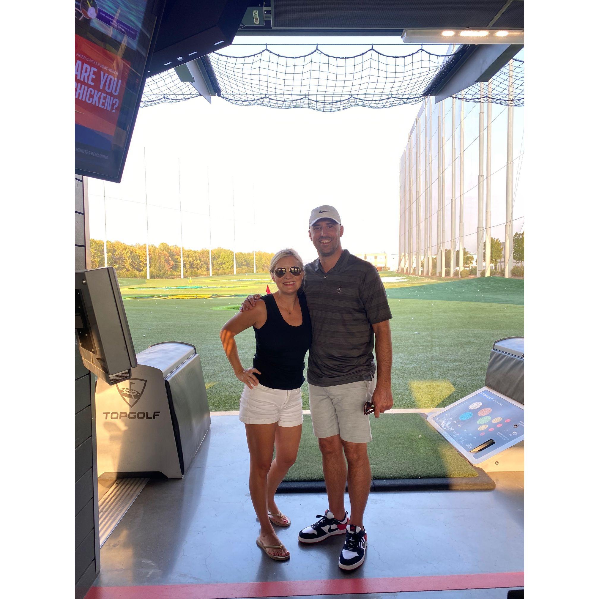 Our first time meeting/first date was at Top Golf! We went on our second date the next day!  This photo taken a year later.