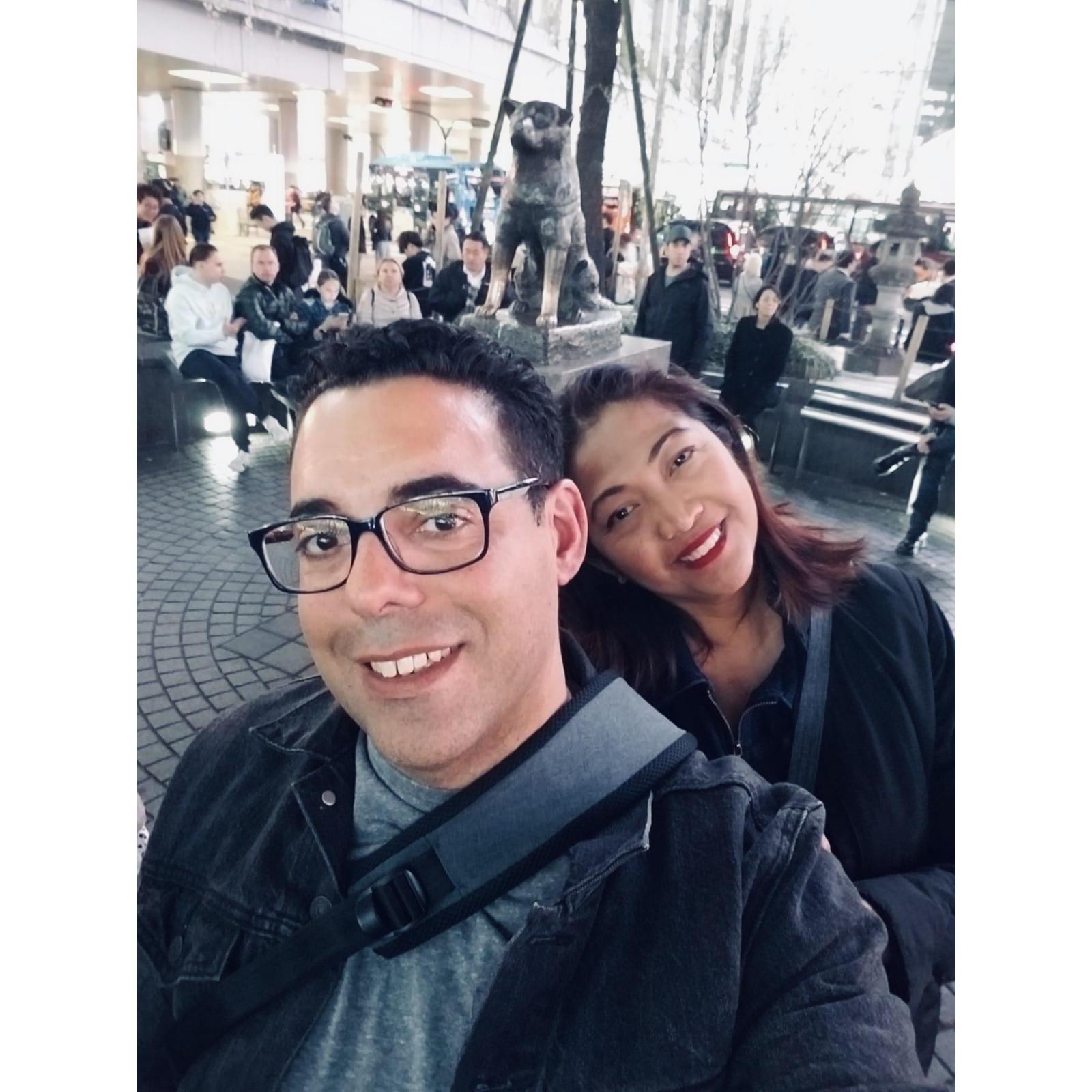 An iconic dog named Hachi behind us located in front of Shibuya station in Tokyo.