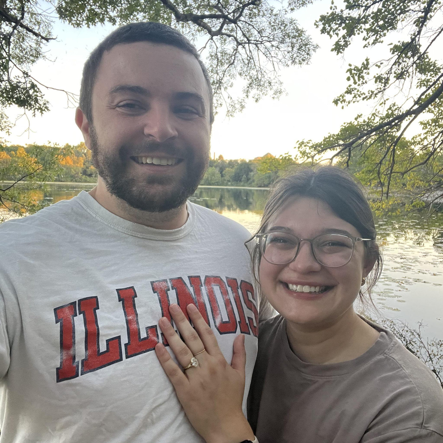 Mike took this photo immediately after proposing on September 17, 2024 while on a walk at Spring Valley Lake in Kalamazoo. Fun fact, Olivia cried so much she almost forgot to say "yes!" π