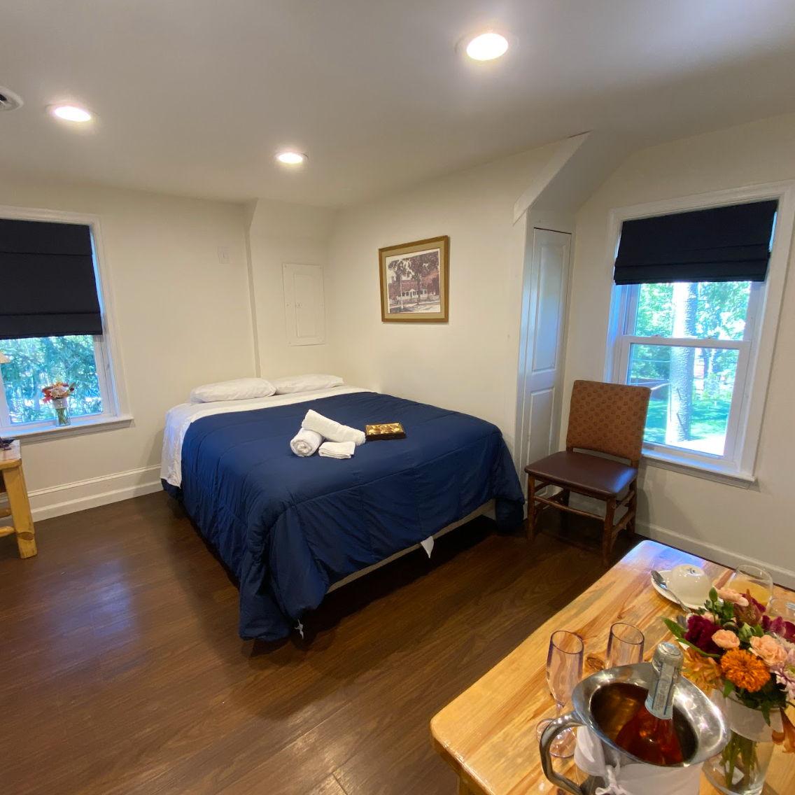 Sneak peak at the private accommodations at Camp Lindenmere - room with a queen size bed!