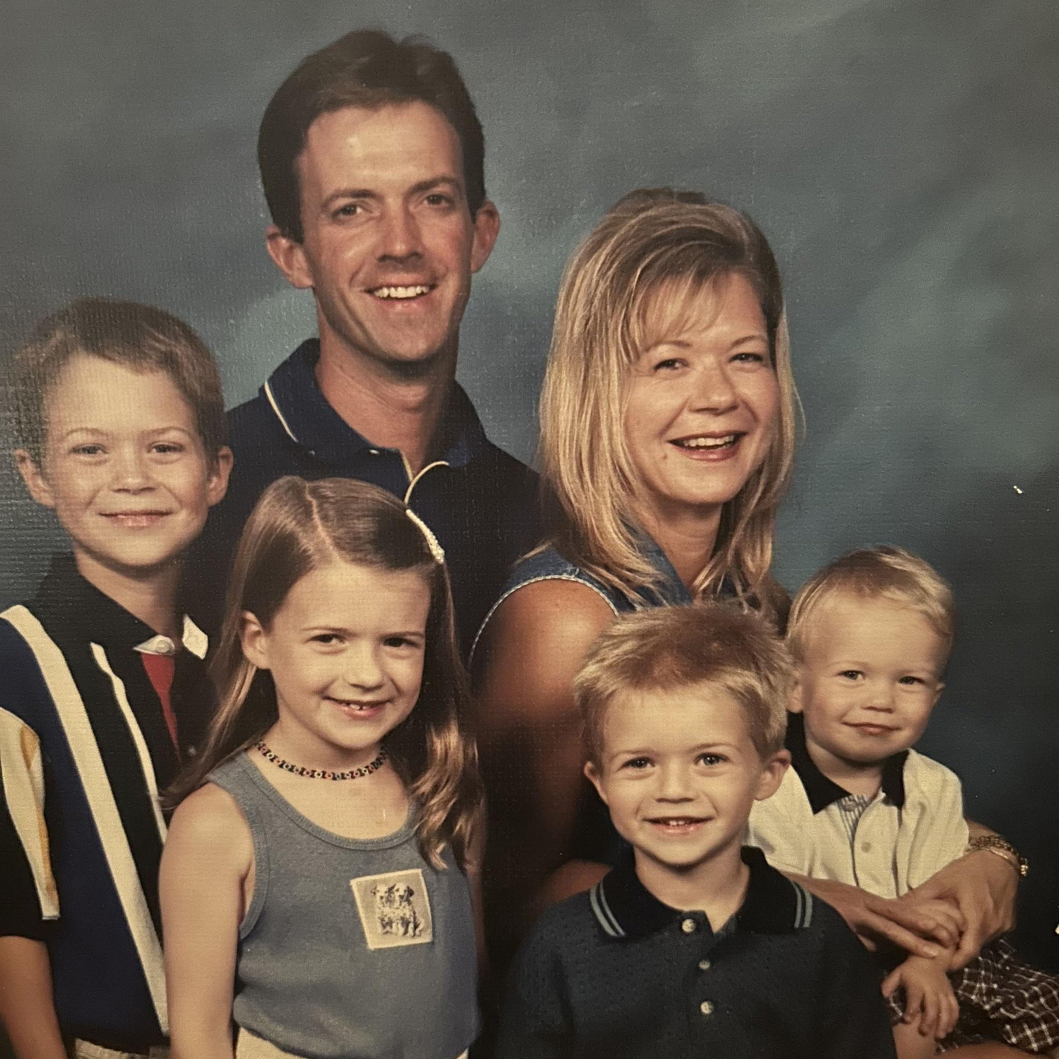 Kyle with his mom, dad, brothers and sister.