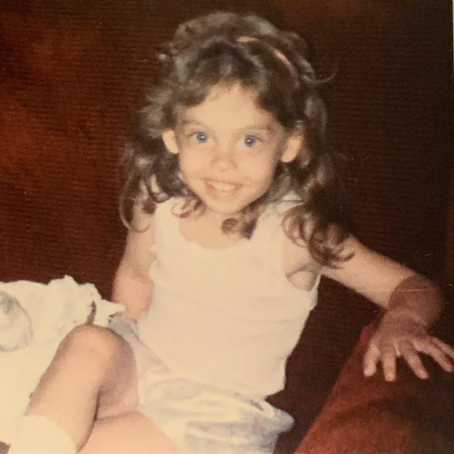 You can barely see the headband under that perm