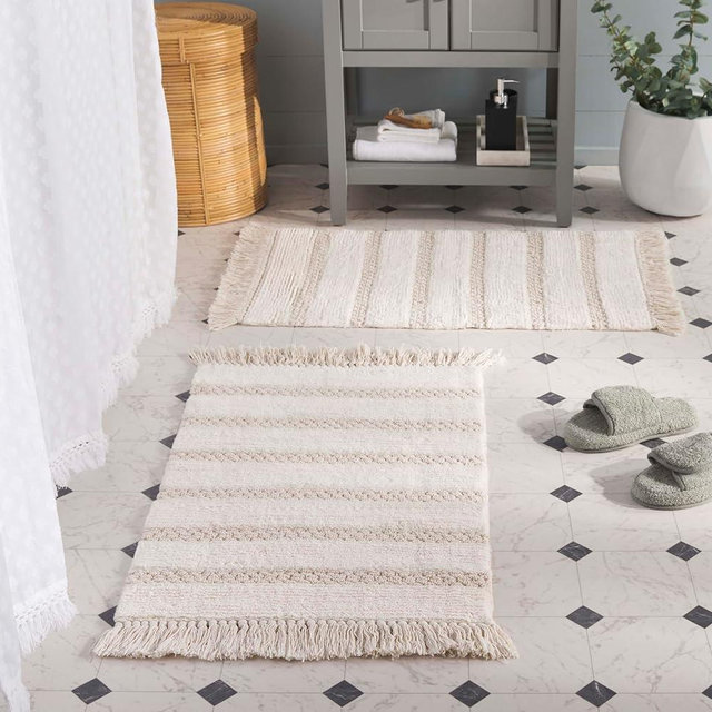 SAFAVIEH Plush Master Bath Finn Collection - 2' x 3', Ivory, Handmade Cotton, Washable & Slip Resistant, Fringe Design, Bathmat Set of 2