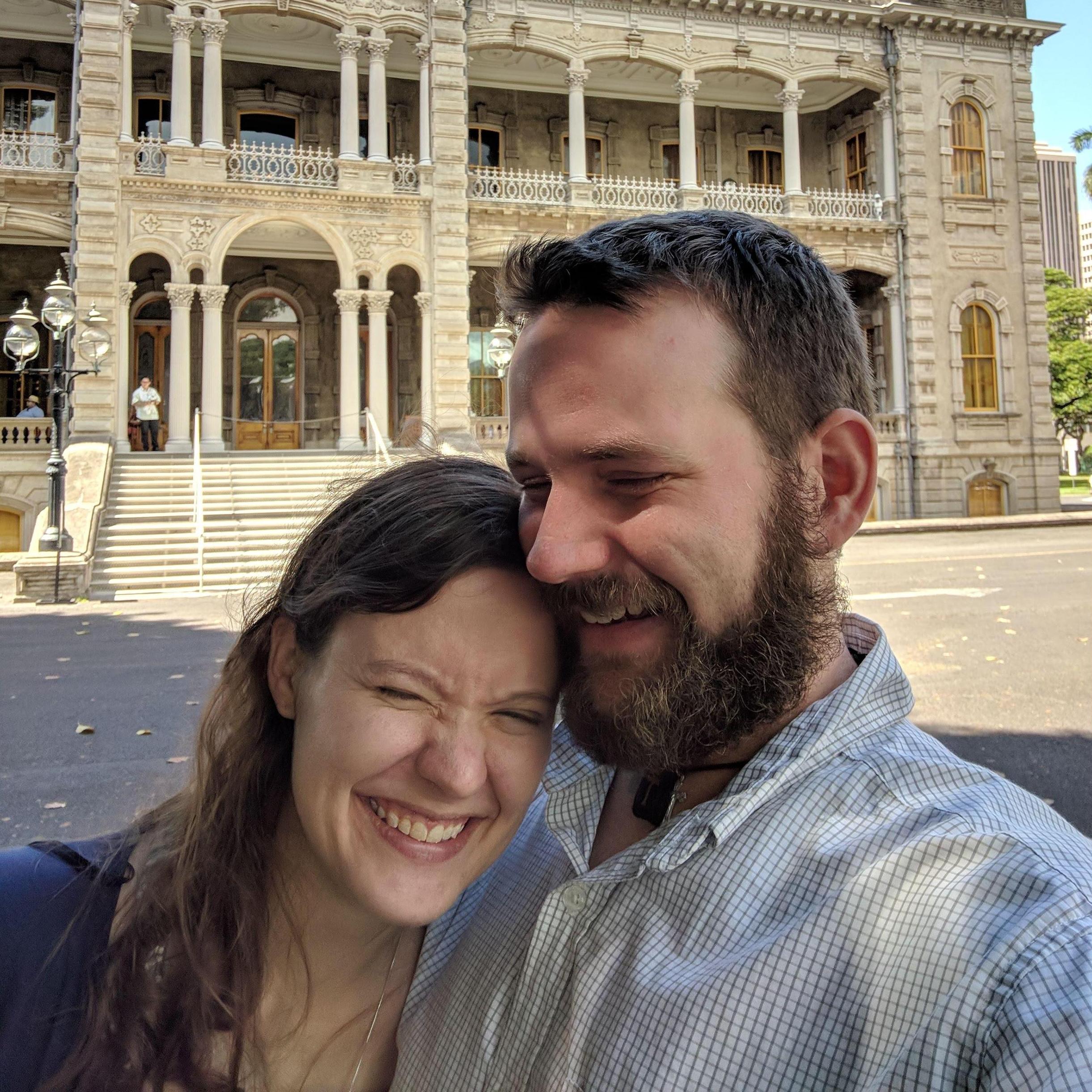 Laughing while waiting for our tour of the 'Iolani Palace in Honolulu (October 2018)