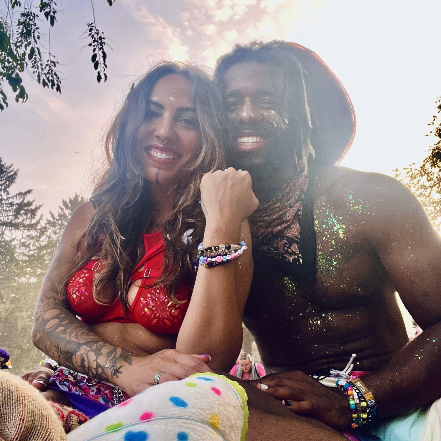 Glittered up and officially a girlfriend! Vernon asked Christina out under a gorgeous tree after they both took a moment to write down their intentions for the festival in their journals.