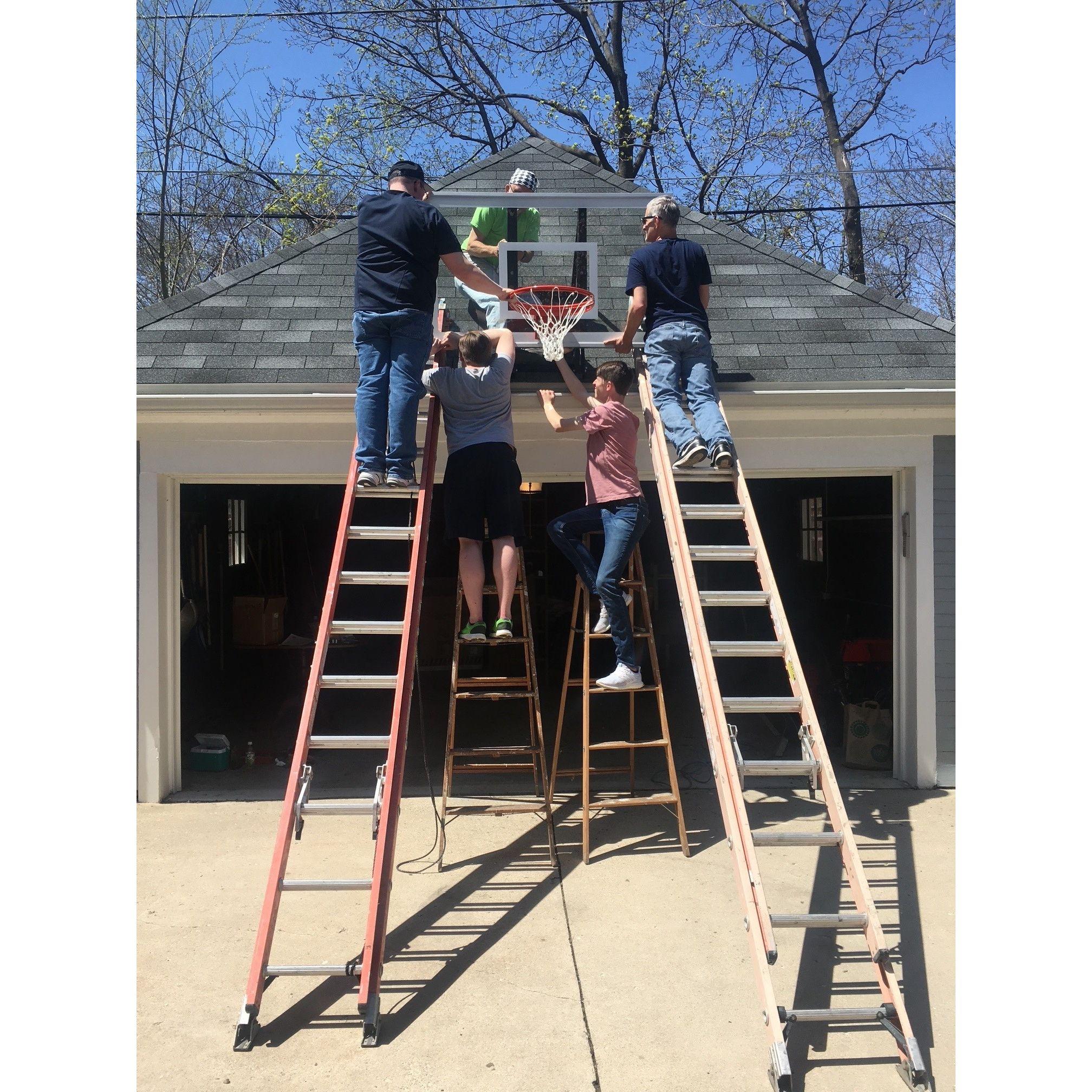 New house, new hoop. Jerry and his brothers and nephews at work