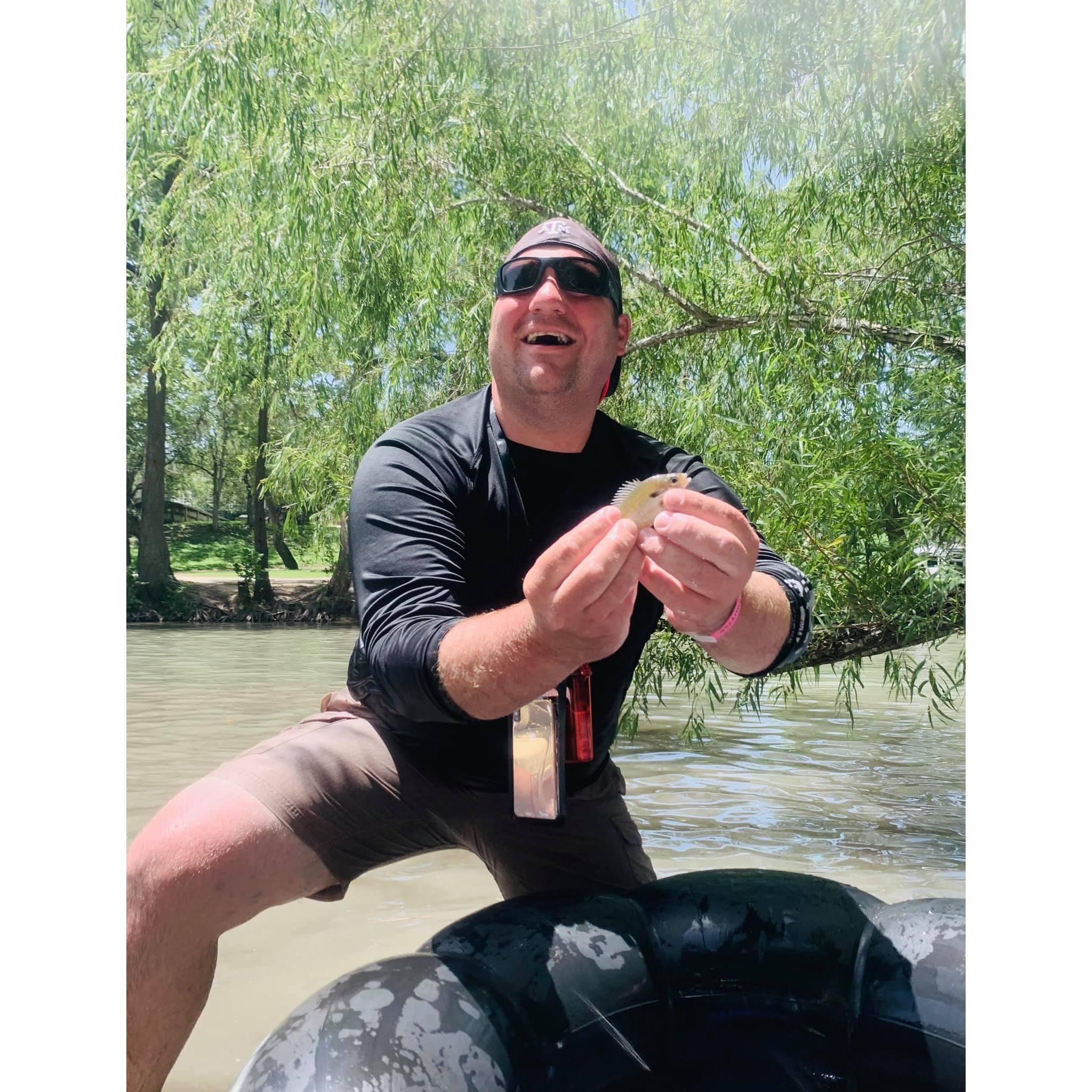 Aaron smiles better when he takes pictures with fish than Kathryn!