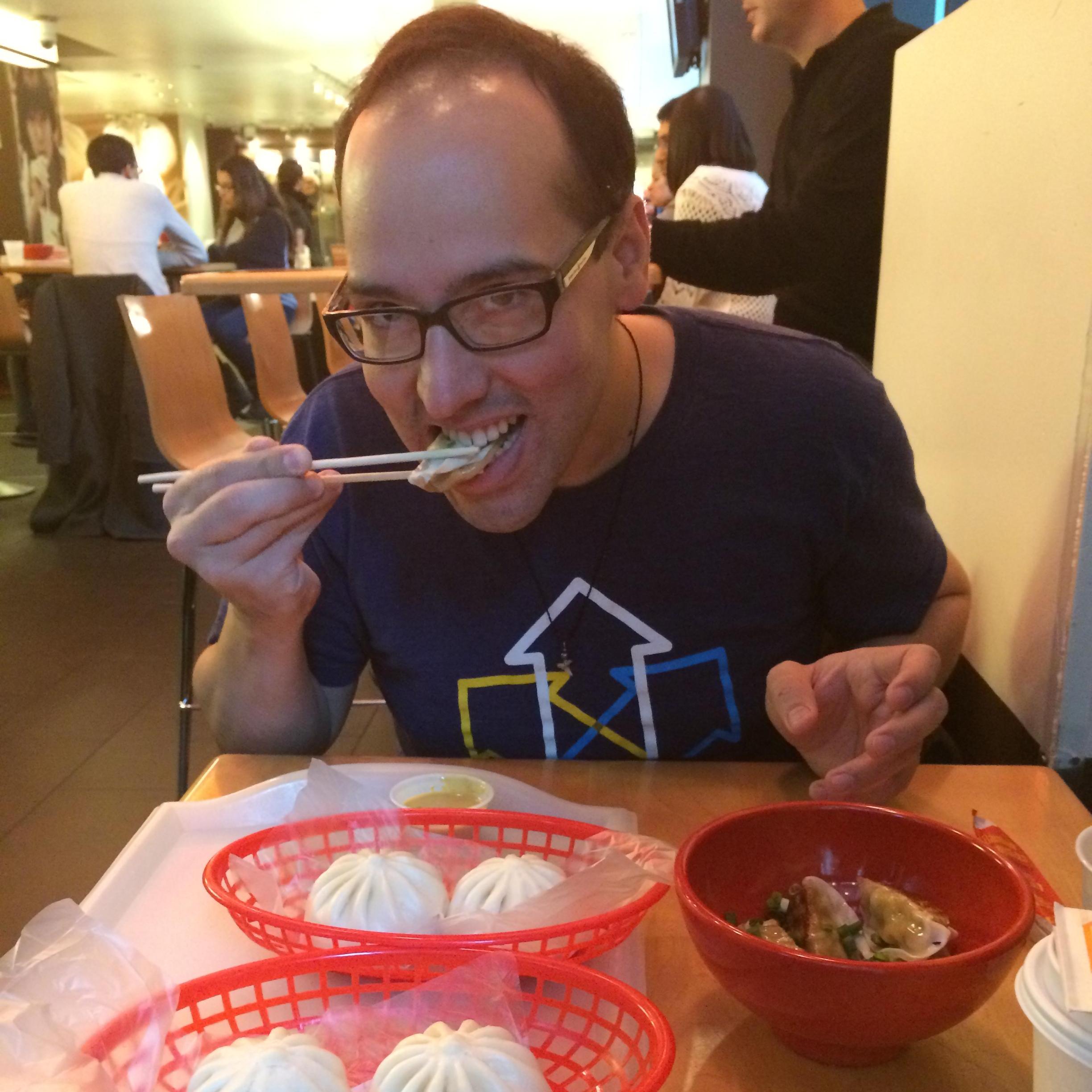 Diego indulging in his favorite activity of who can eat all the Baozi first.