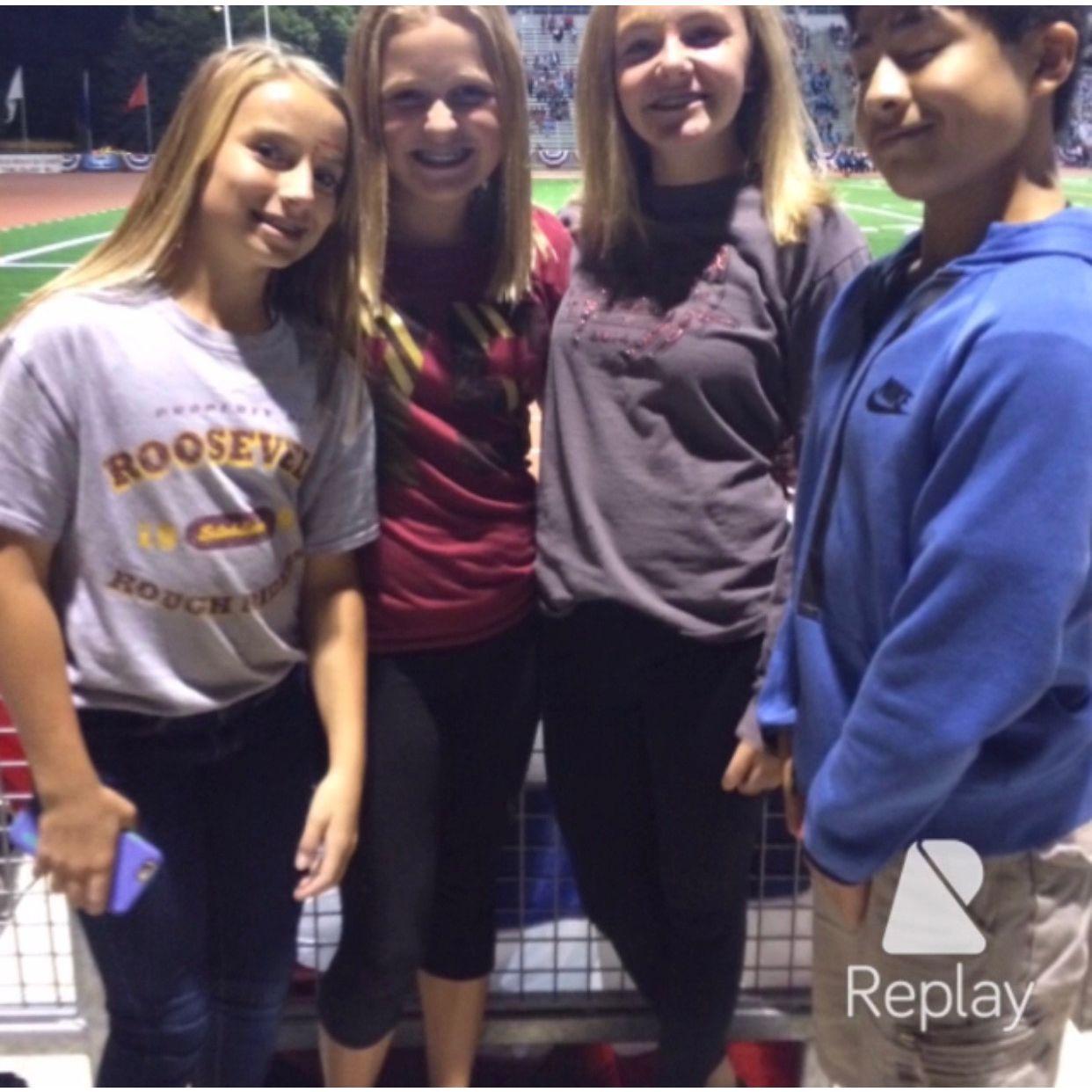2016 - Our very first photo "together". Early 8th grade at a high school football game.