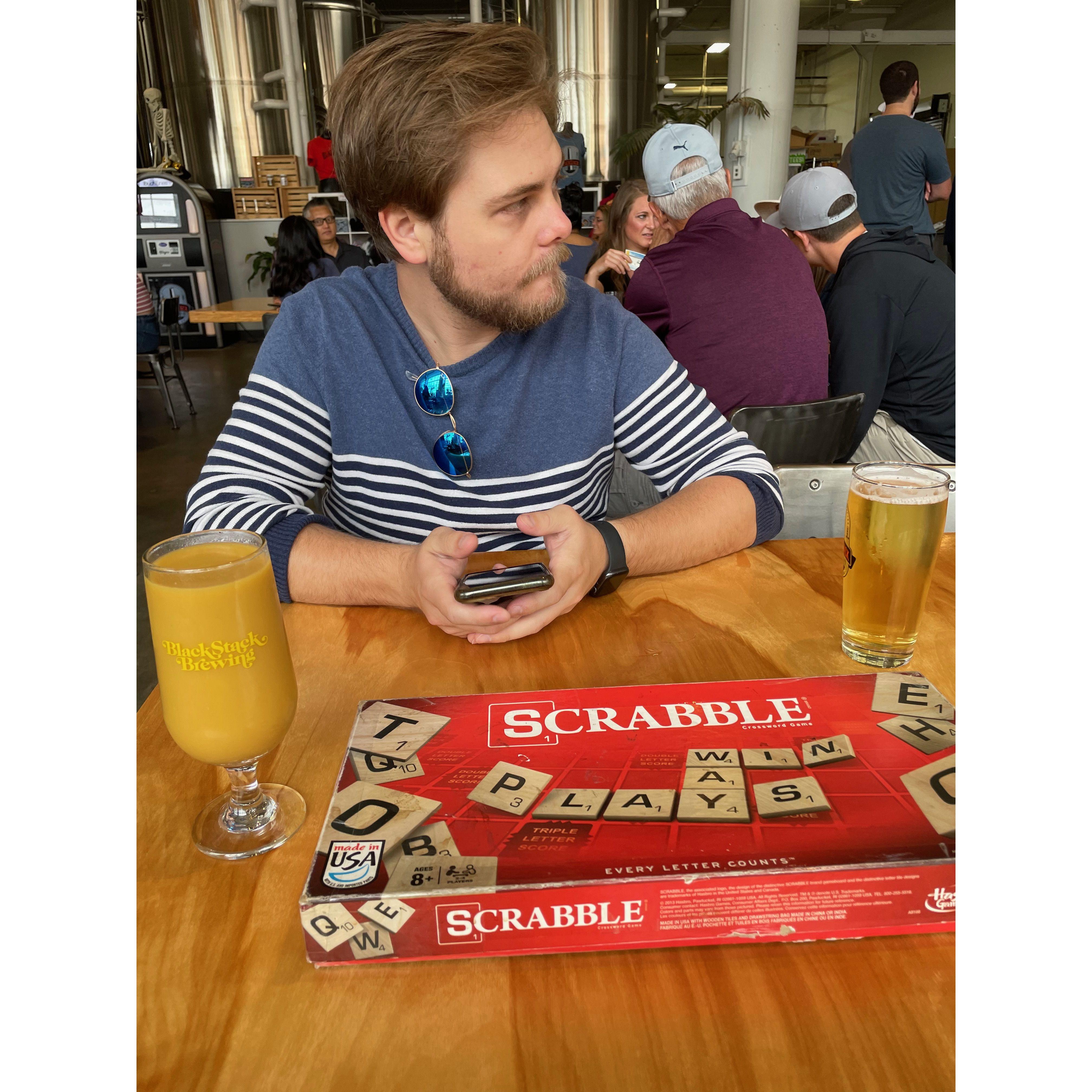 We love to go to breweries and play games; this was at our 5th anniversary--Anthony won at scrabble!