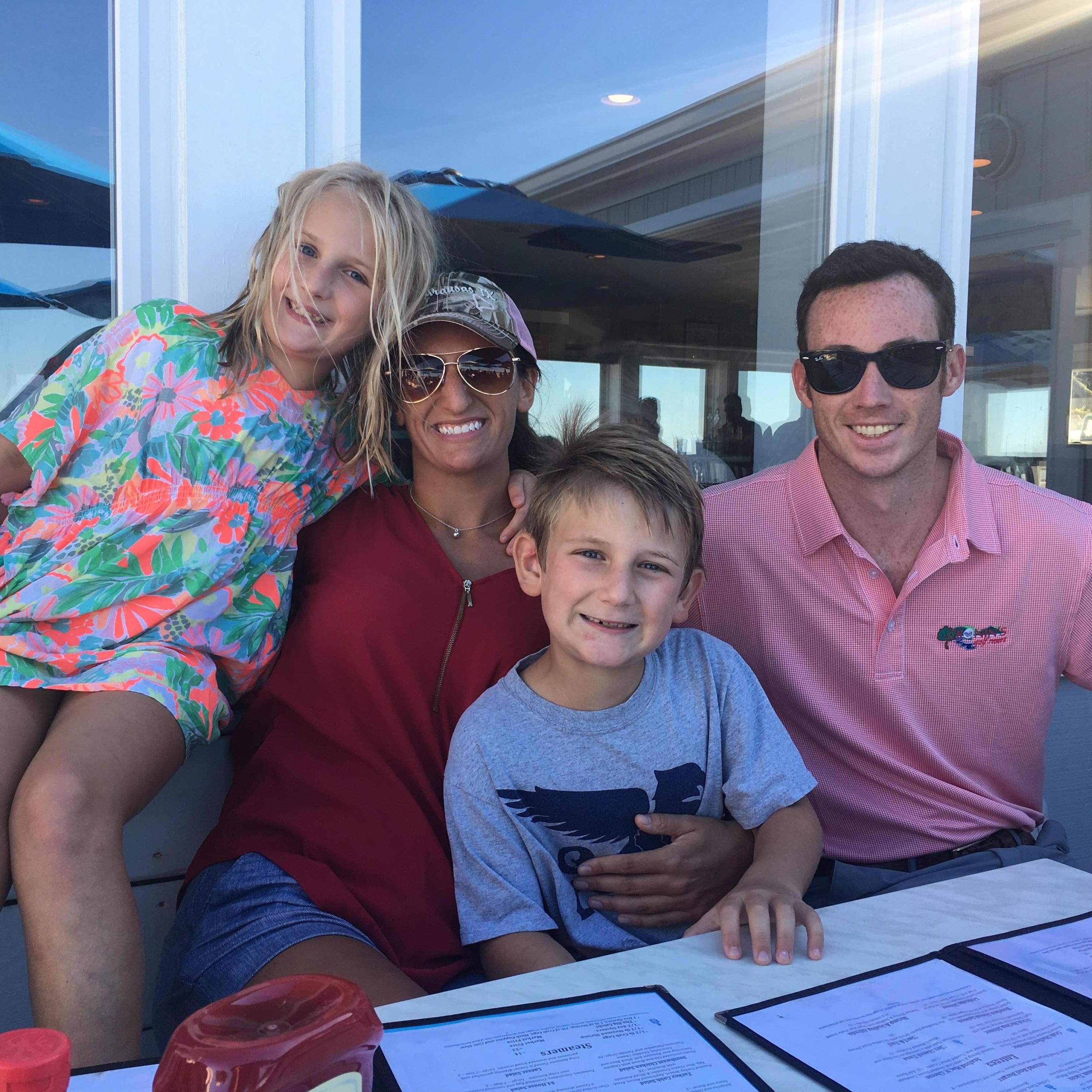 Teaching Henri and Genevieve how to eat crab legs in Virginia Beach.