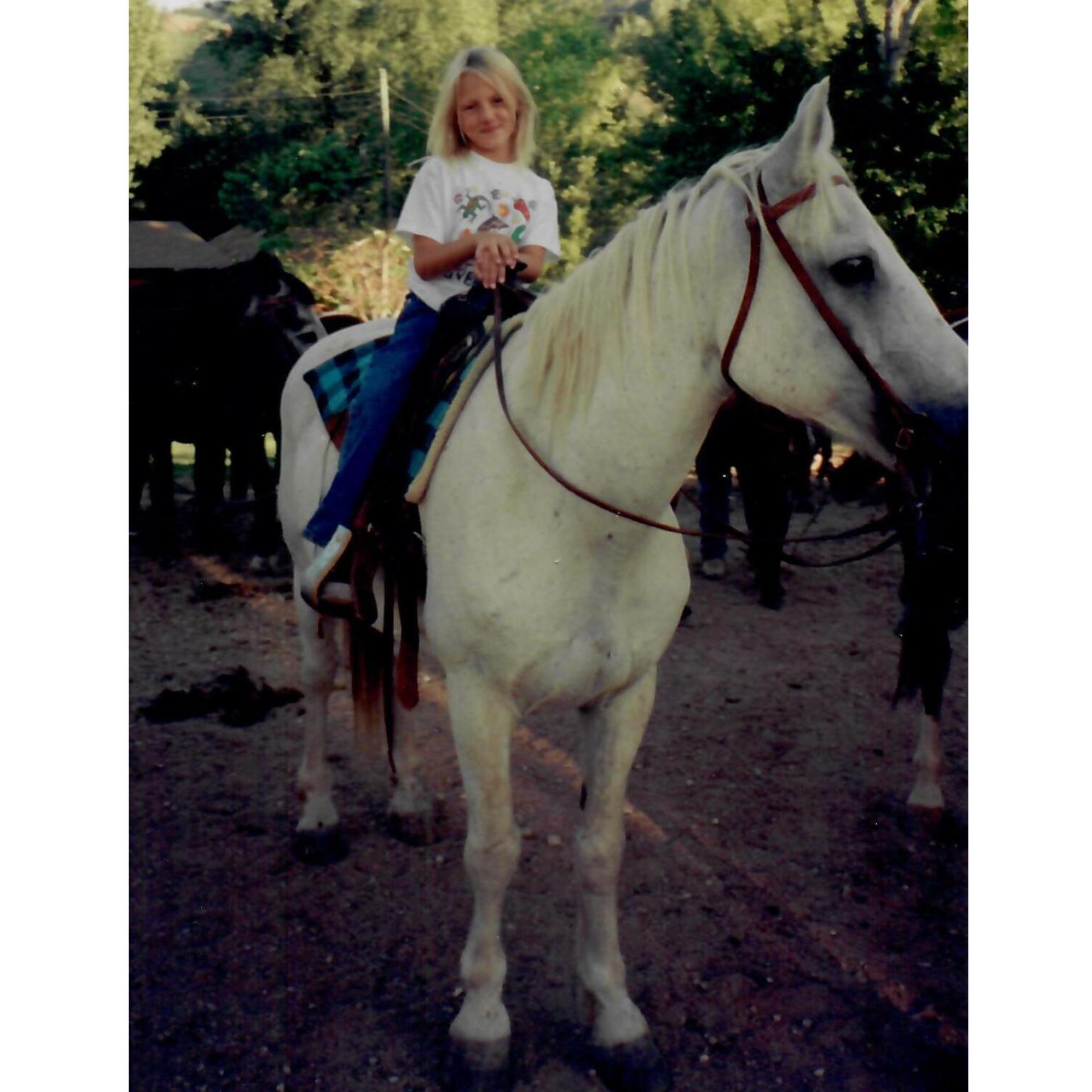 2001 - Charlotte riding a horse in Wyoming