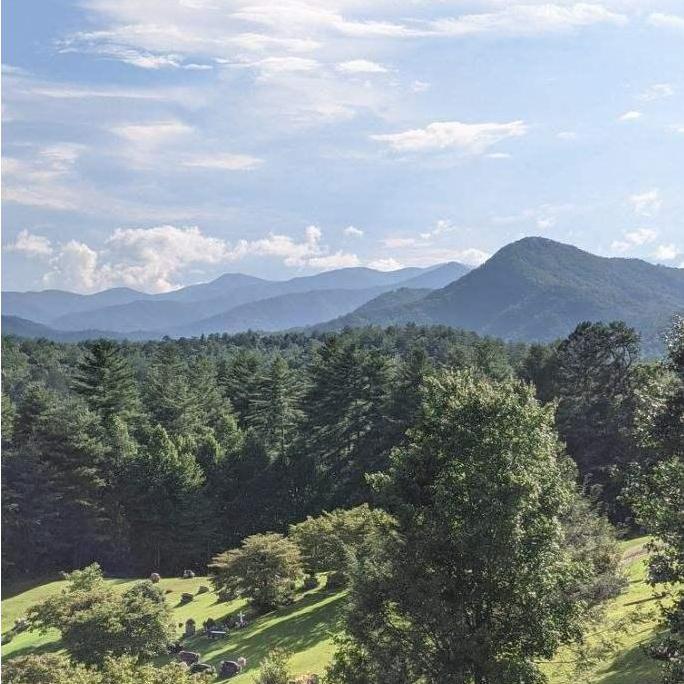 The most beautiful view from a Baptist church parking lot overlooking a cemetery