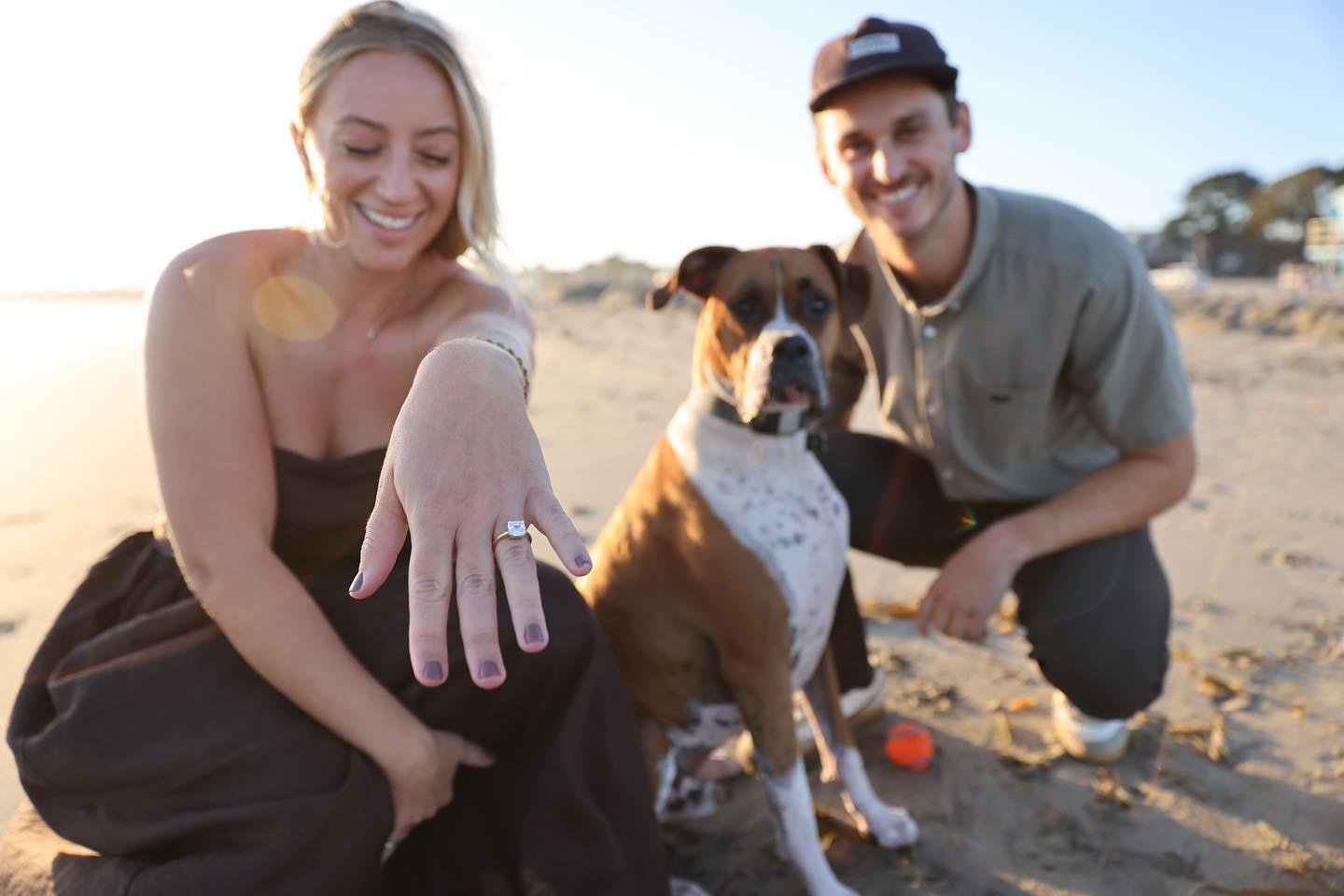 Celebrating the engagement with Hank by throwing the ball.