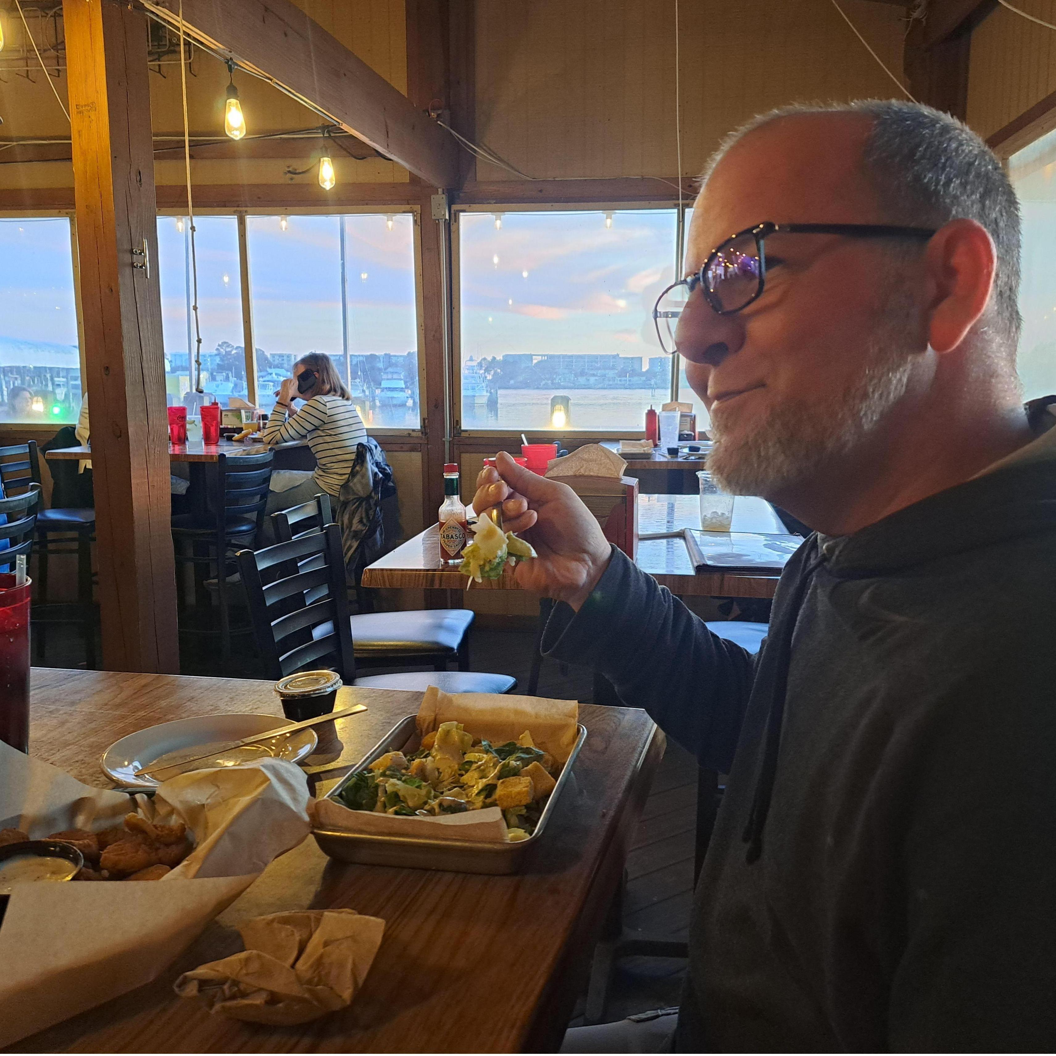 April 2023. V first told G she loved him over fried pickles. Said pickles are pictured in the left foreground.