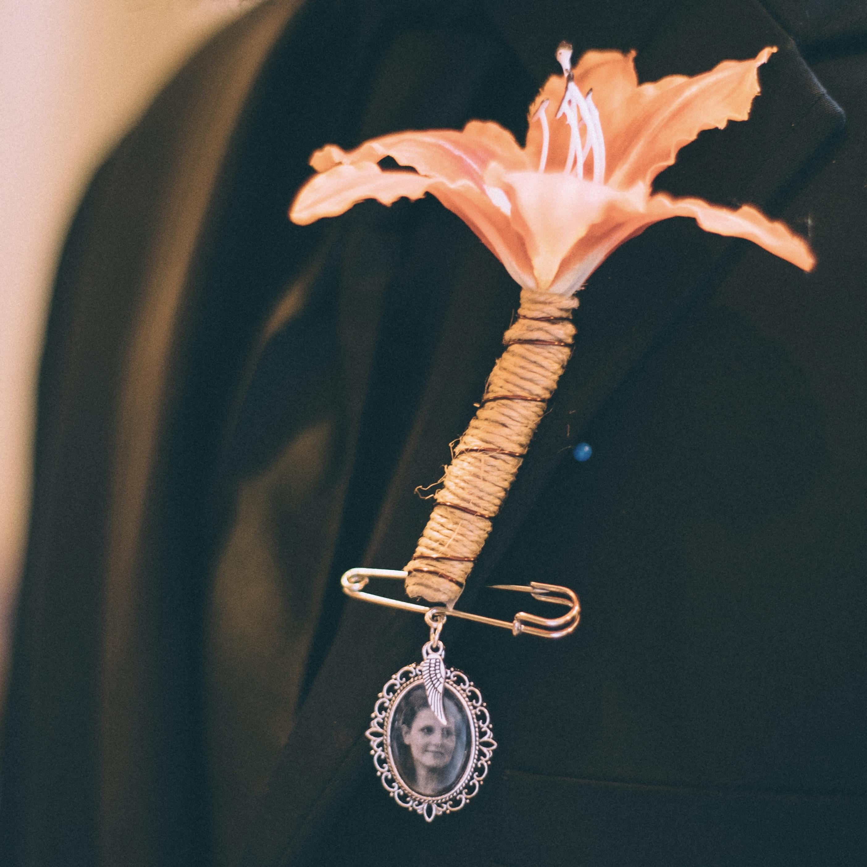 Tyler's boutonniere and charm of his mother JoAnne
