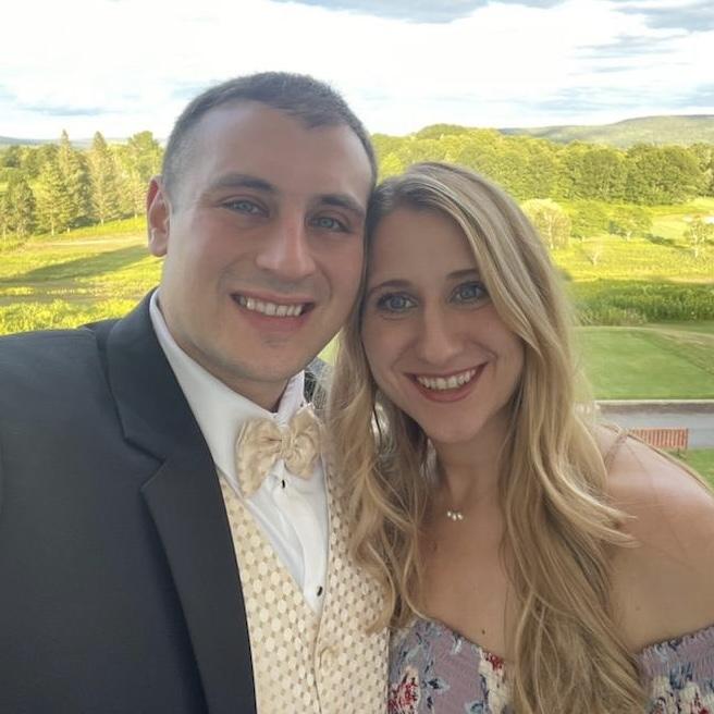 Some of their favorite things to do together are play boardgames, spend time with the many kitties in their lives, and attend the weddings of friends and family.