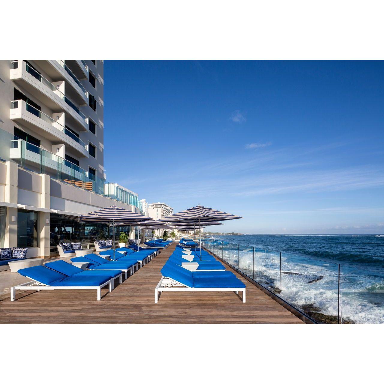 Overlooking the Atlantic Ocean, this meticulously restored Spanish Revival property blends classic grandeur with modern sophistication